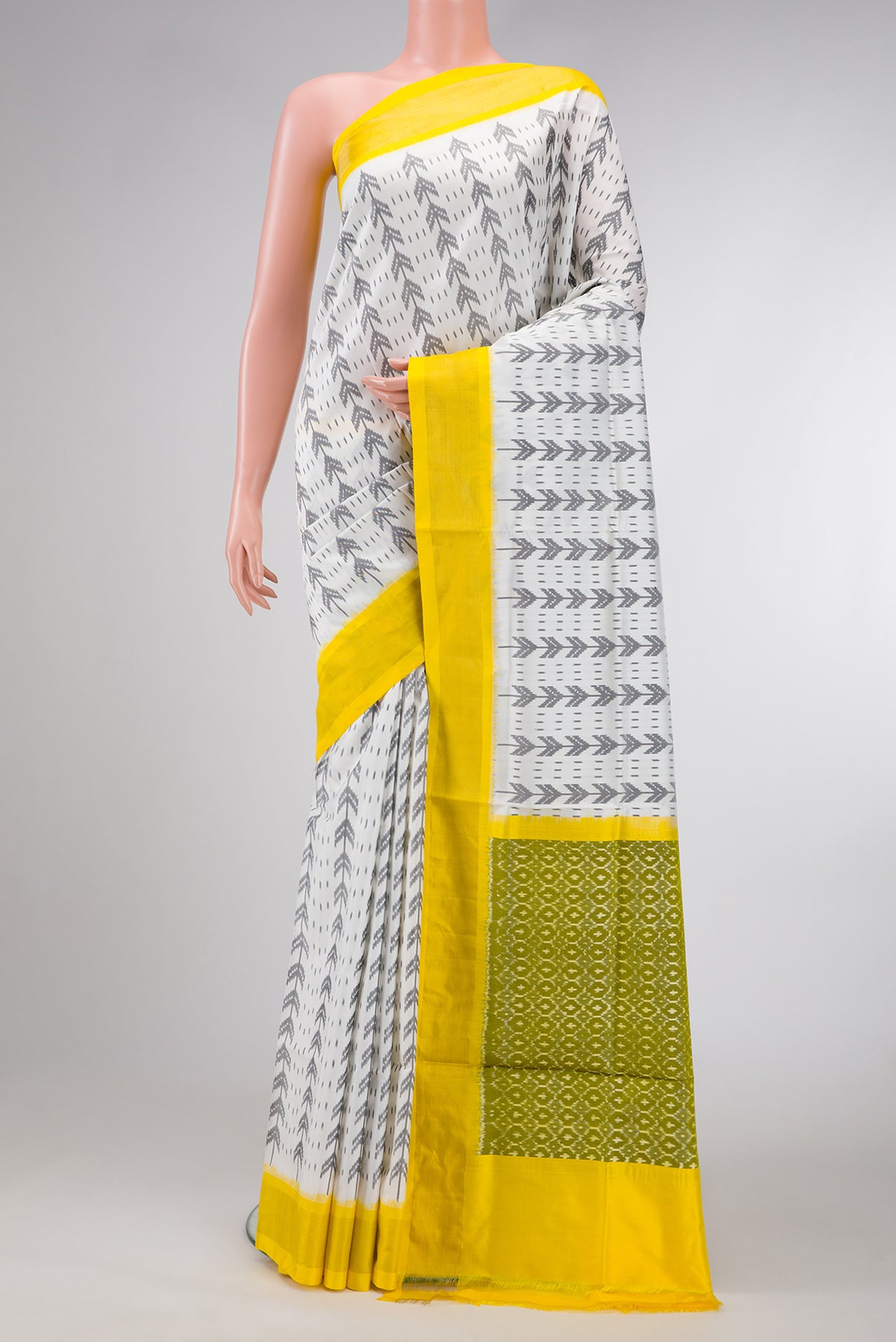 Off White Dual Tone Double Ikat Saree with Ikat Print on the body and Zari Border.  displayed on a mannequin
