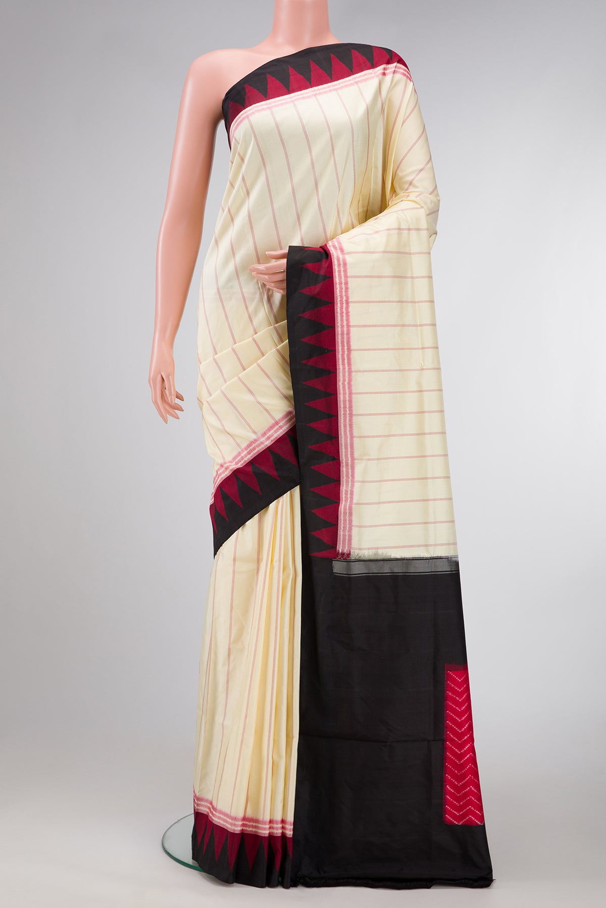 Sandal Dual Tone Double Ikat Saree with Stripes on the body and Ikat Border.  displayed on a mannequin