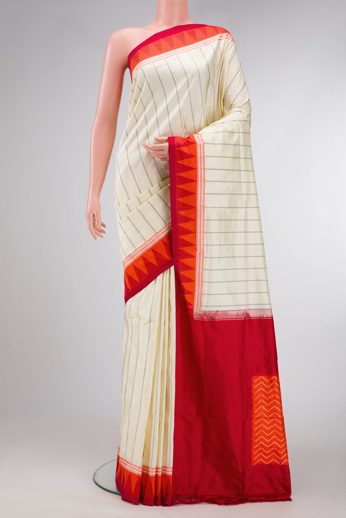 Sandal Dual Tone Double Ikat Saree with Stripes on the body and Ikat Border.  displayed on a mannequin