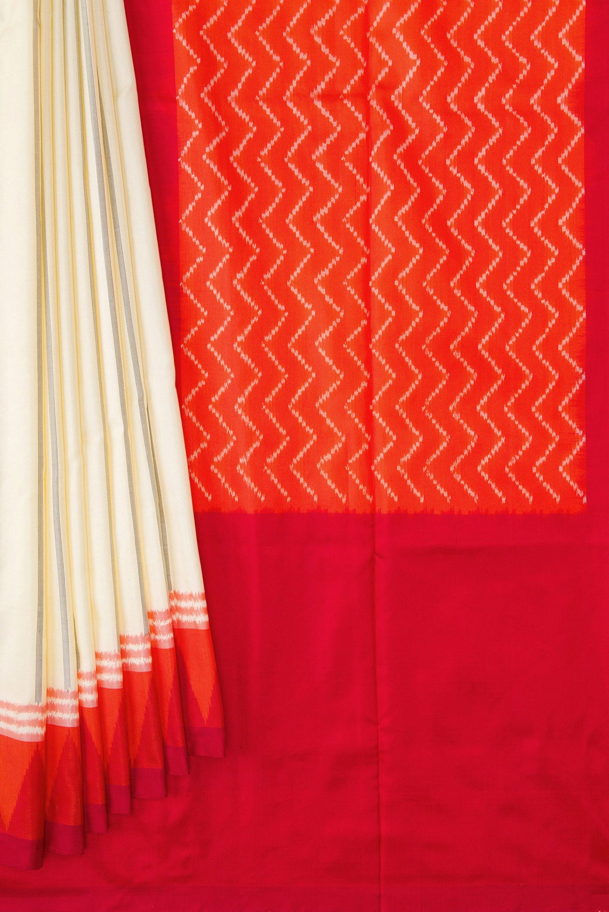 Pleats and pallu of Sandal Dual Tone Double Ikat Saree with Stripes on the body and Ikat Border. 