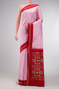 Pure Silk Pure Zari Pink Dual Tone Double Ikat Saree with Checked design on the body and Thread Border.  displayed on a mannequin