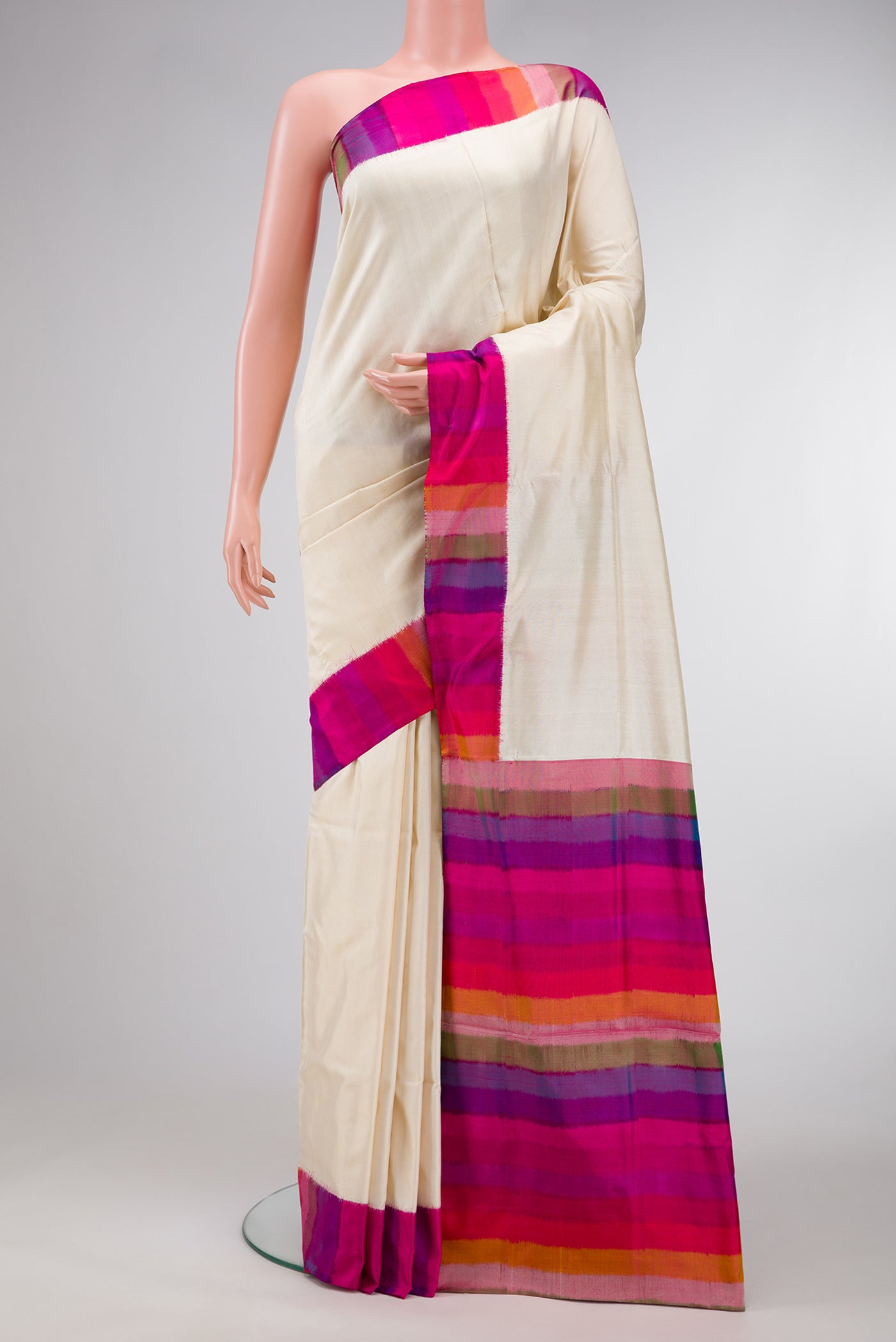 Off White Dual Tone Double Ikat Saree with Plain Body and Ikat Border.  displayed on a mannequin