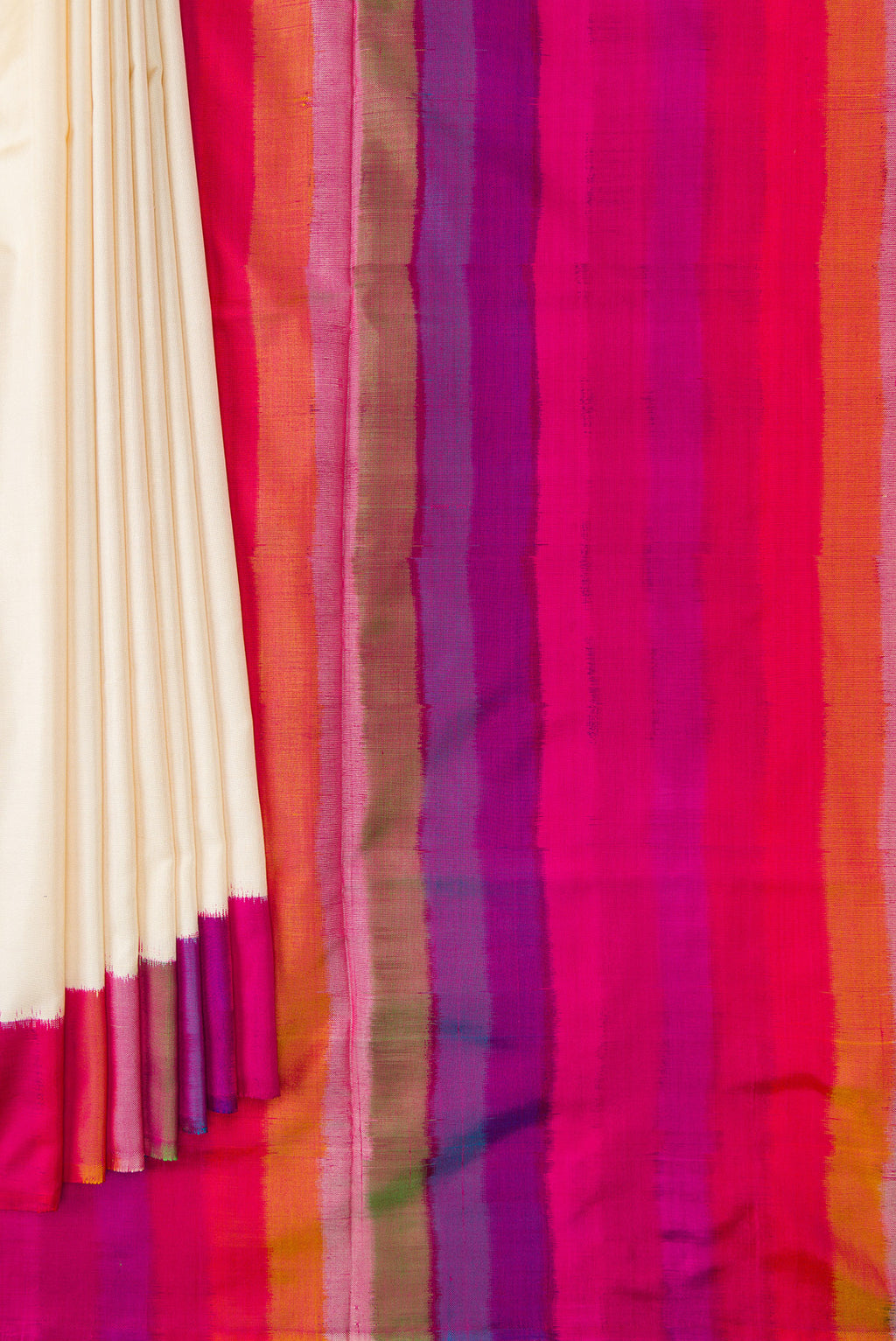 Pleats and pallu of Off White Dual Tone Double Ikat Saree with Plain Body and Ikat Border. 