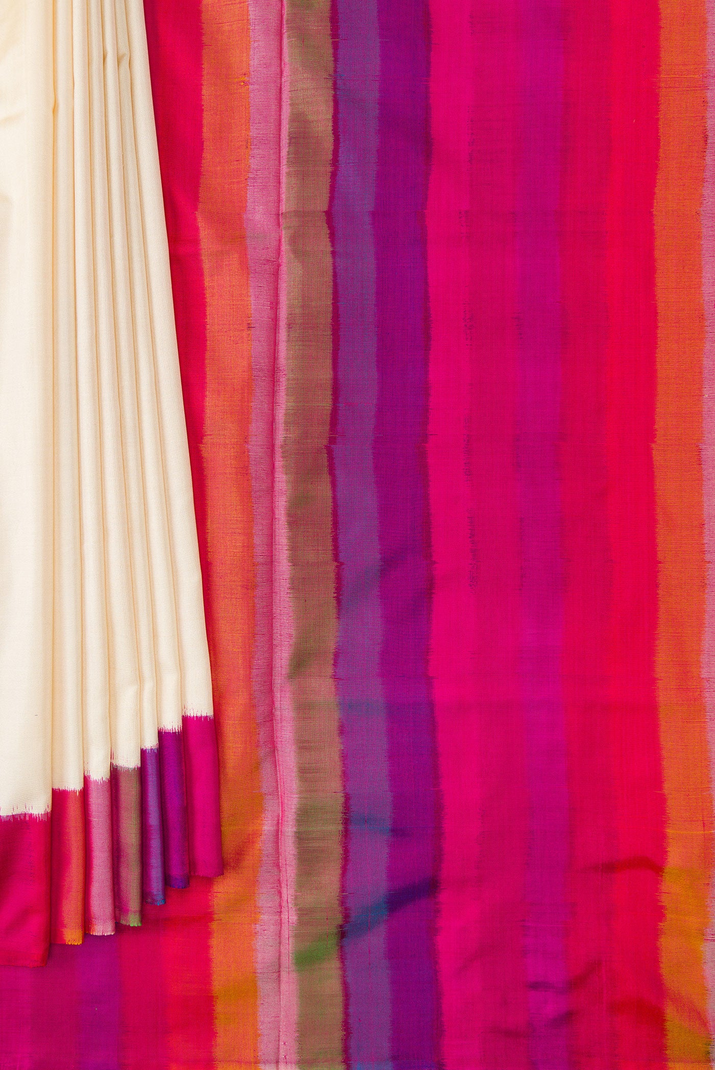 Pleats and pallu of Off White Dual Tone Double Ikat Saree with Plain Body and Ikat Border. 
