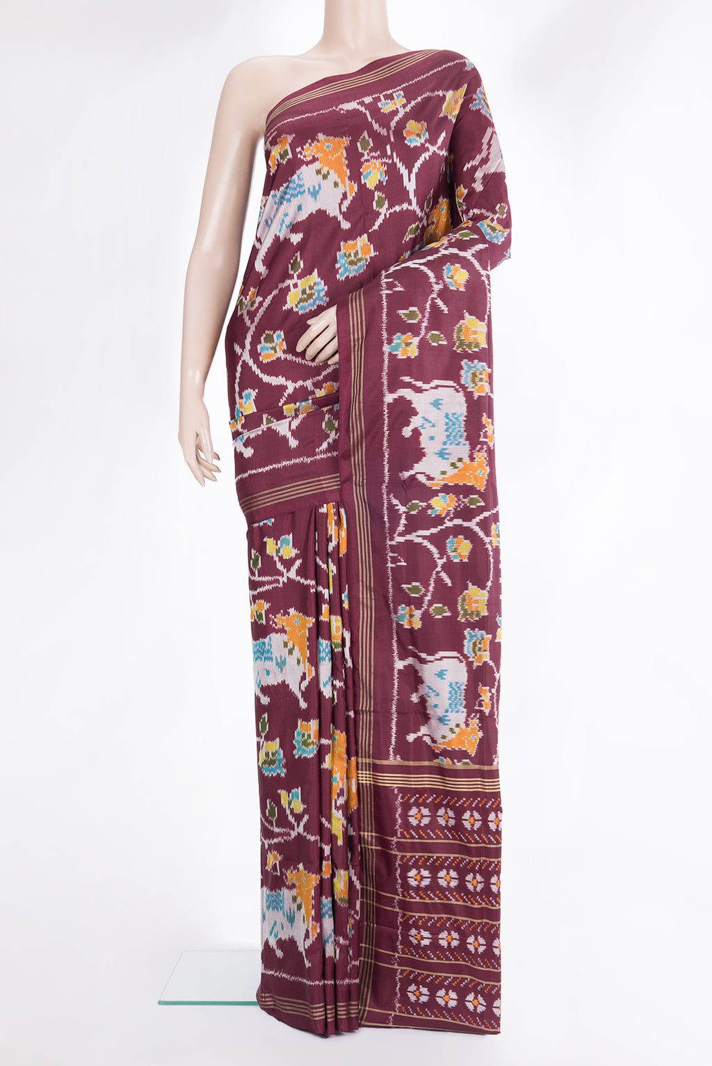 Pure Silk Maroon Pochampally Saree with Ikat design on the body and Thread Border.  displayed on a mannequin