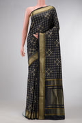 Black Dual Tone Banarasi Silk Saree with Zari Butta on the body and Zari Border.  displayed on a mannequin