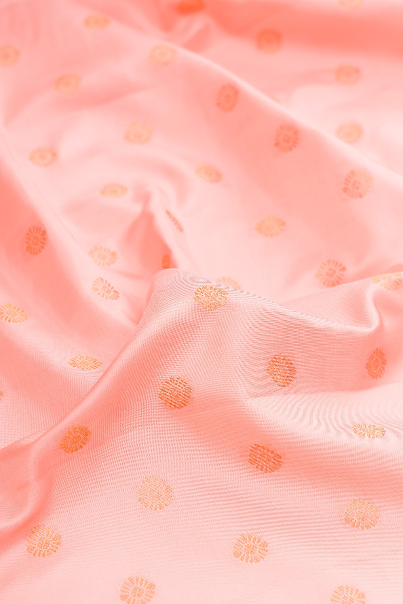 Close up of Pink Dual Tone Gadwal Silk Saree with Zari Butta on the body and Zari Border.  displaying folds