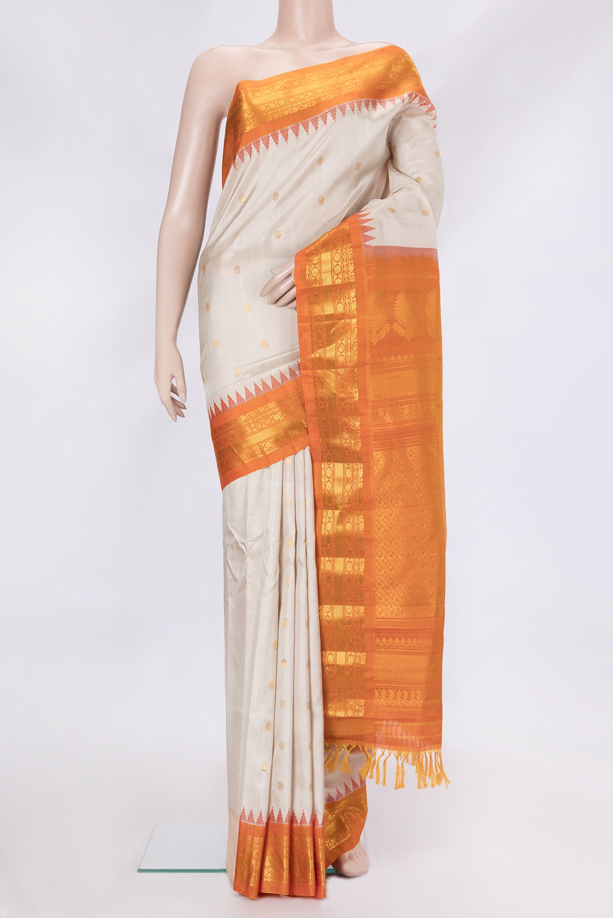 Beige Dual Tone Gadwal Silk Saree with Zari Butta on the body and Zari Border.  displayed on a mannequin