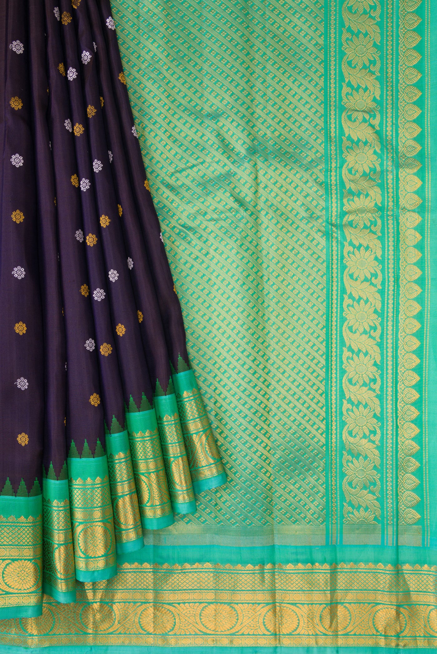 Pleats and pallu of Navy Blue Dual Tone Gadwal Silk Saree with Zari And Thread Butta on the body and Zari Border. 