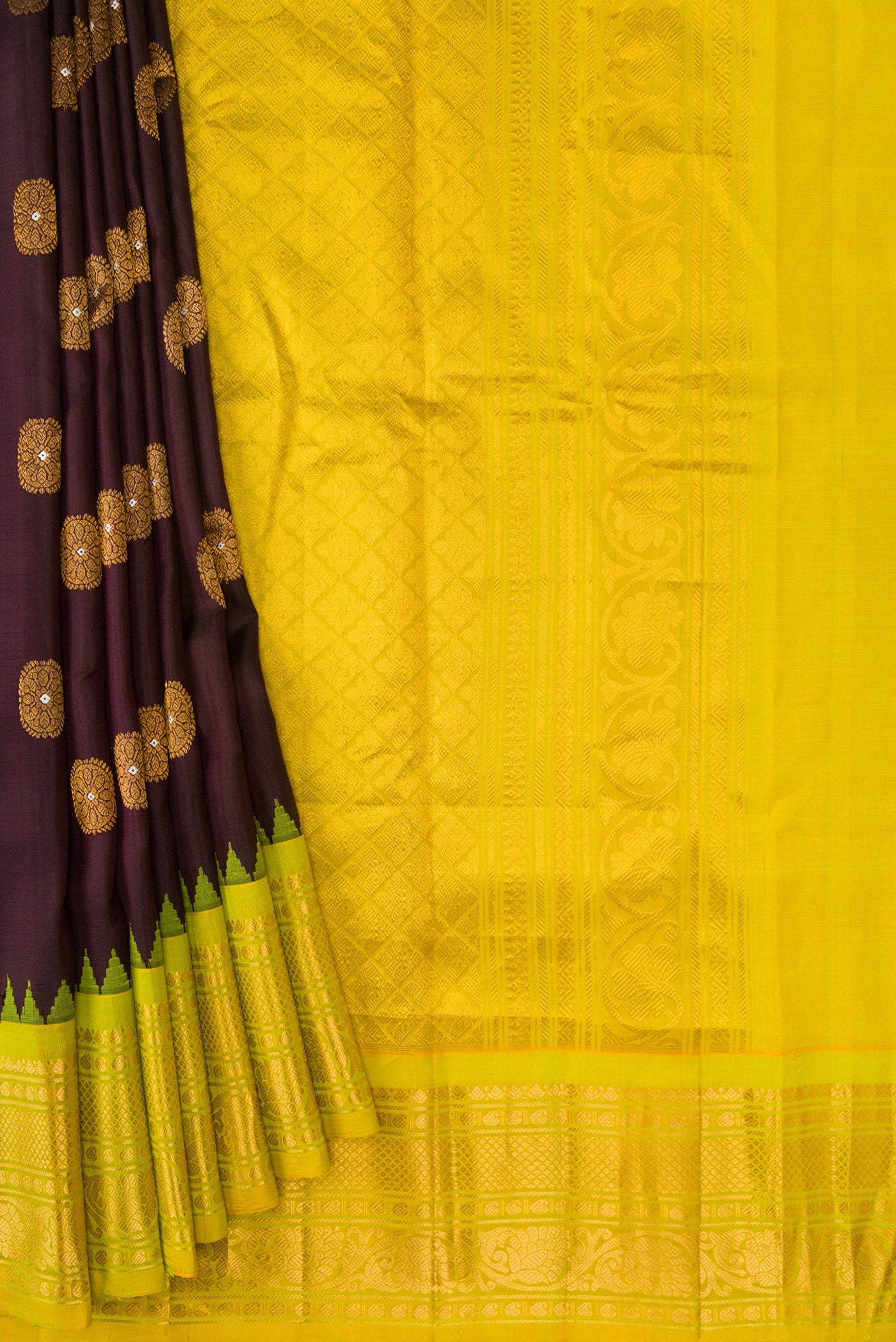Pleats and pallu of Coffee Brown Dual Tone Gadwal Silk Saree with Zari And Thread Butta on the body and Zari Border. 
