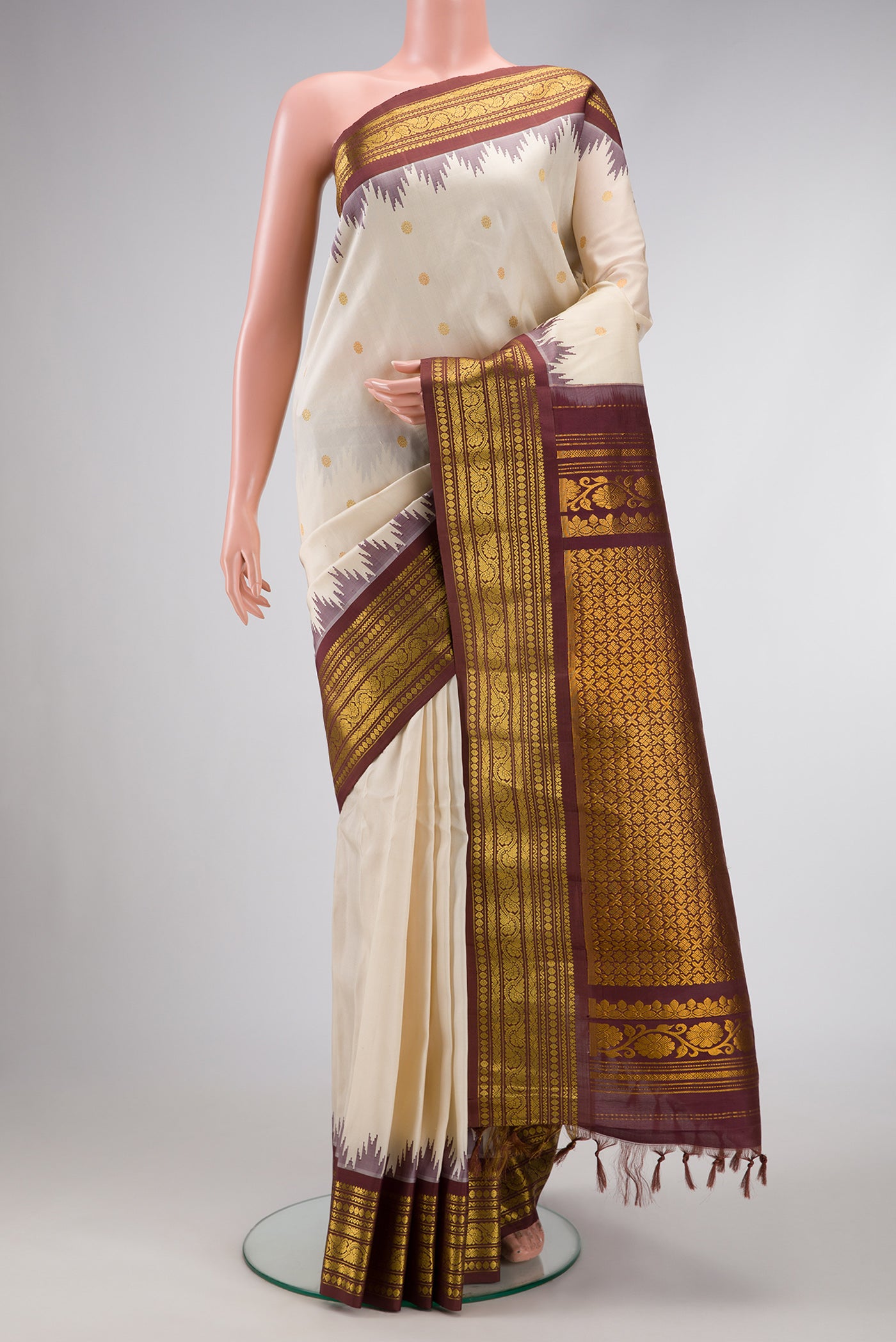 Beige Dual Tone Gadwal Silk Saree with Zari Butta on the body and Zari Border.  displayed on a mannequin