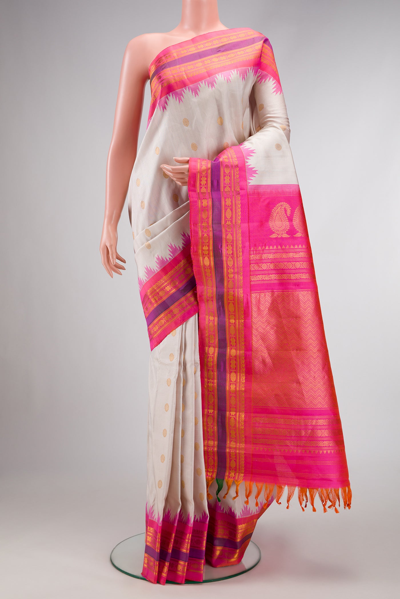 Beige Dual Tone Gadwal Silk Saree with Zari Butta on the body and Zari Border.  displayed on a mannequin