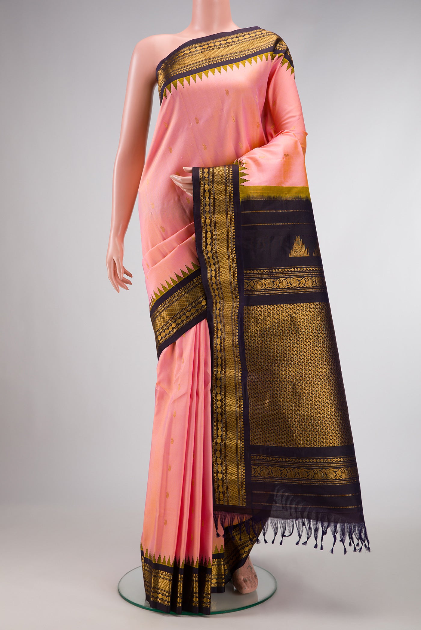 Coral Dual Tone Gadwal Silk Saree with Zari Butta on the body and Zari Border.  displayed on a mannequin