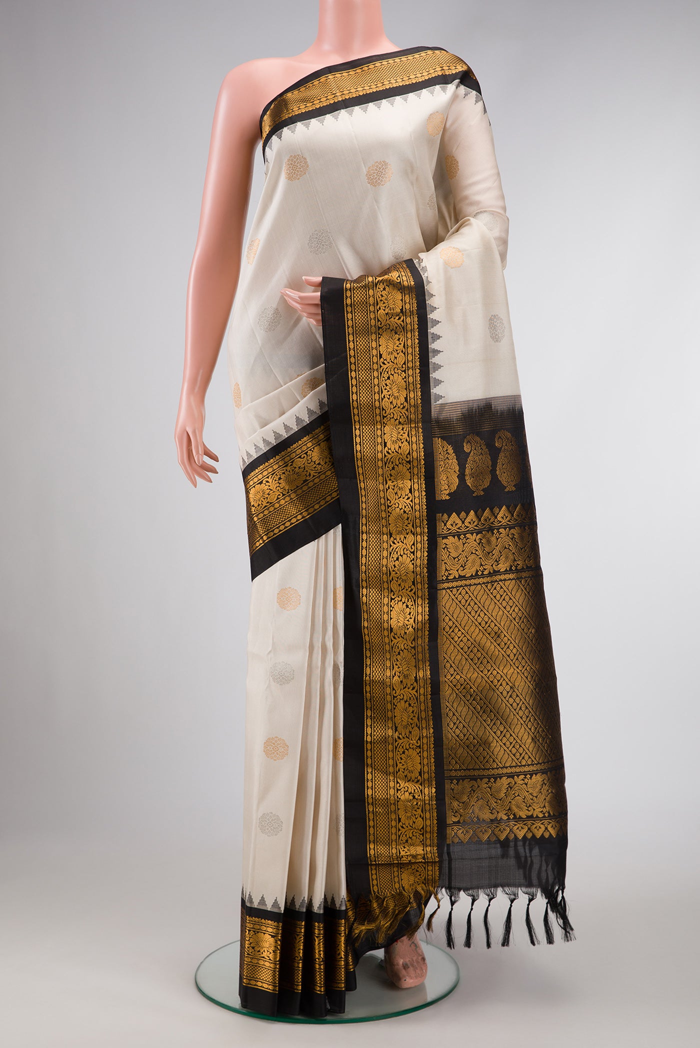 Beige Dual Tone Gadwal Silk Saree with Zari Butta on the body and Zari Border.  displayed on a mannequin