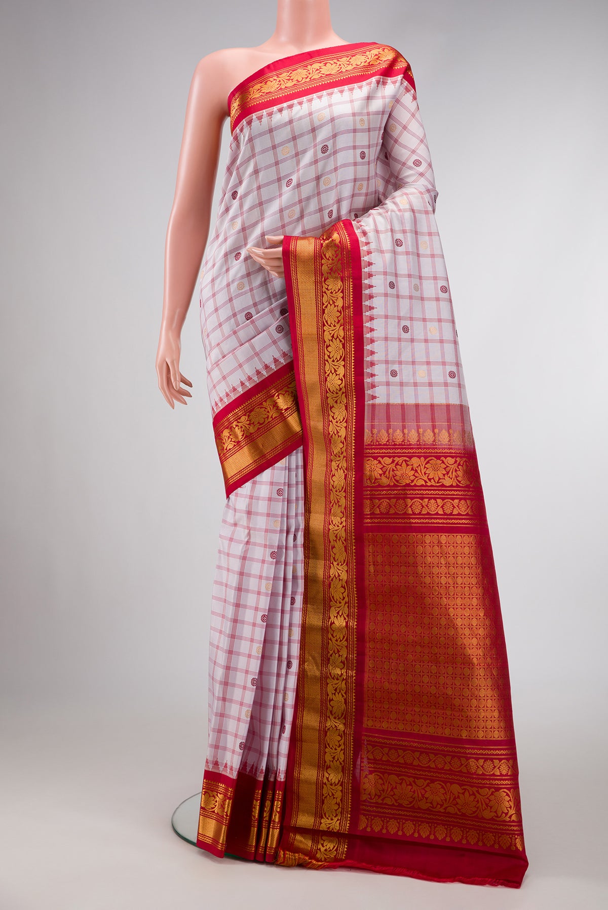 Off White Dual Tone Gadwal Silk Saree with Checked design on the body and Zari Border.  displayed on a mannequin