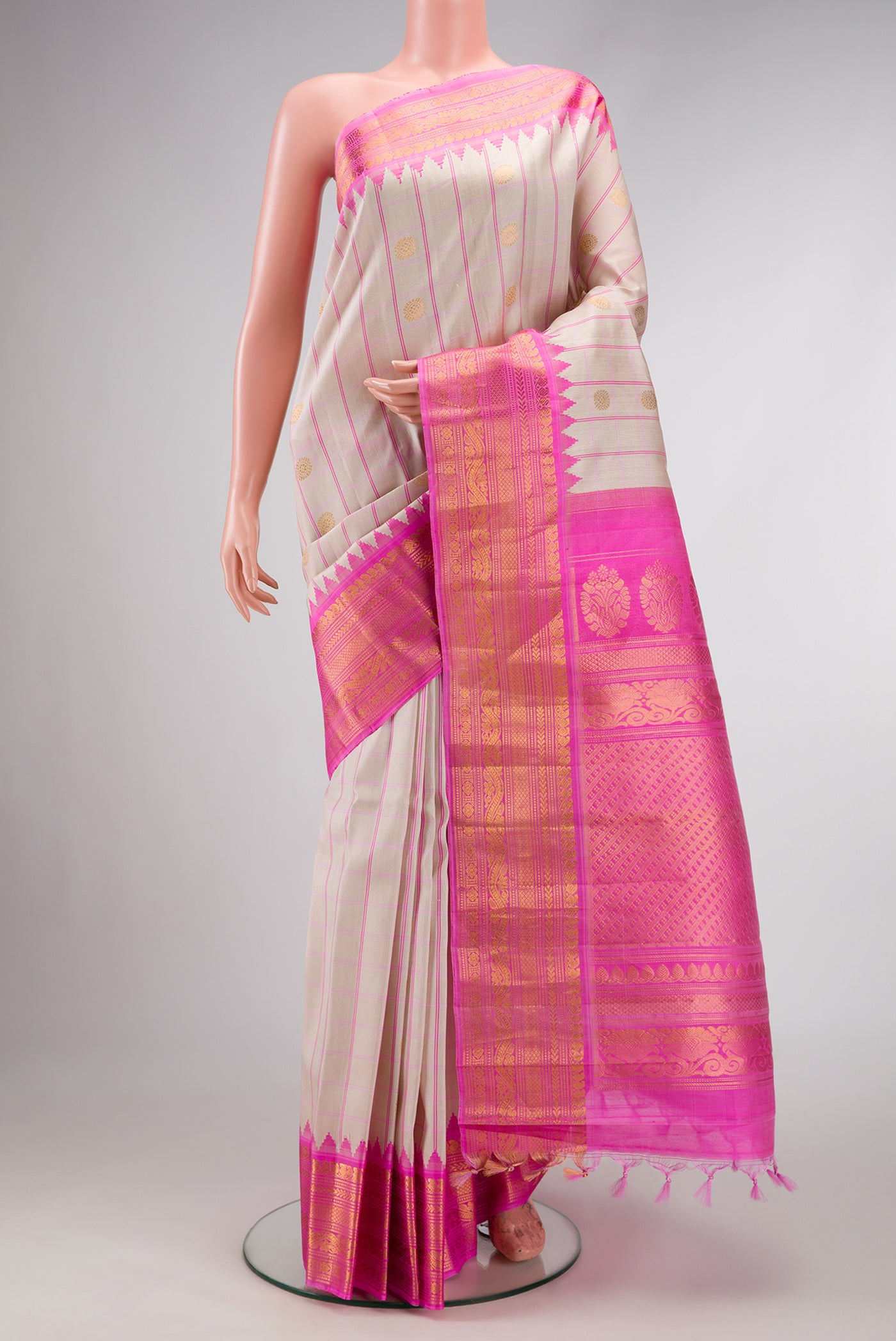 Beige Dual Tone Gadwal Silk Saree with Checked design on the body and Zari Border.  displayed on a mannequin