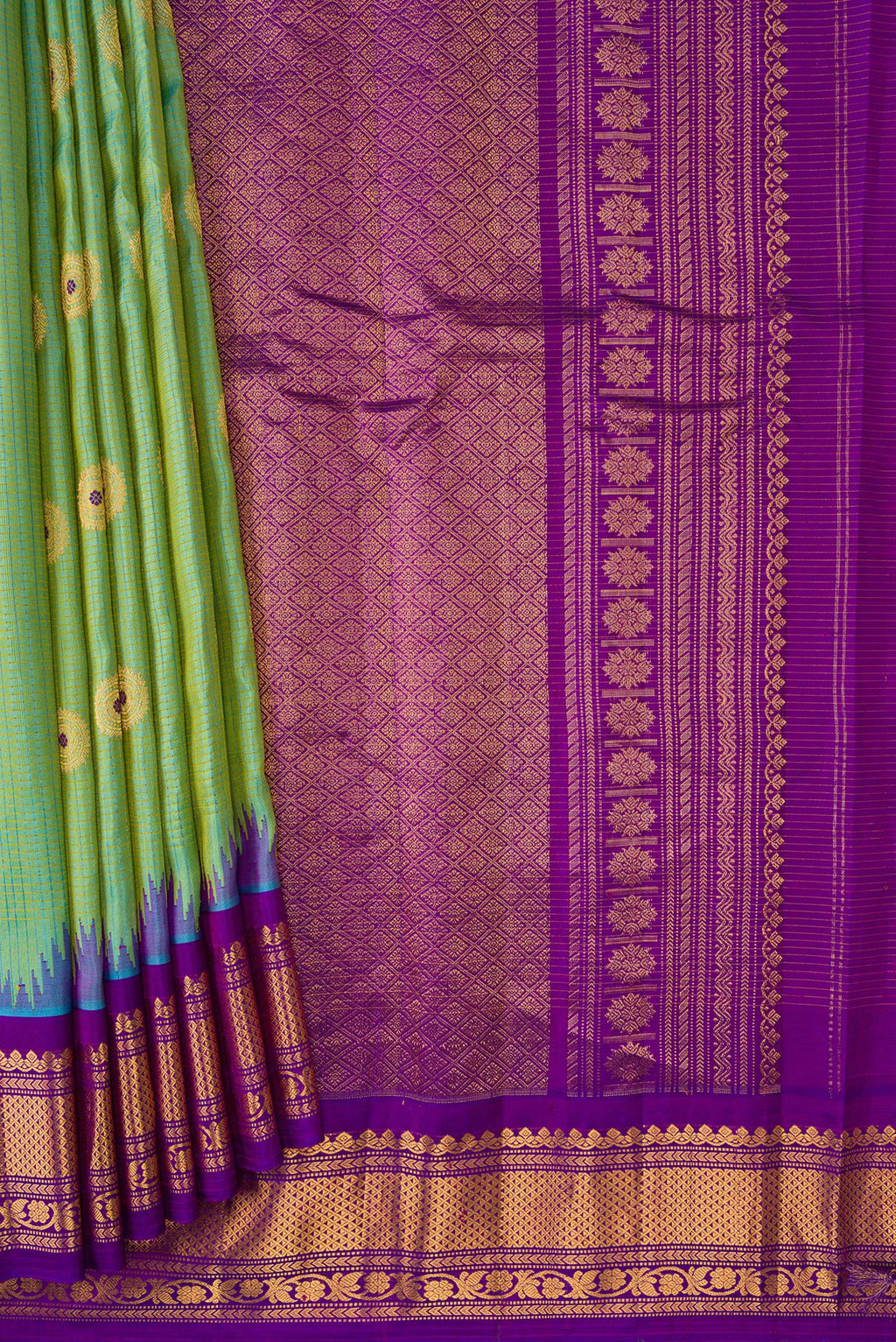 Pleats and pallu of Light Green Dual Tone Gadwal Silk Saree with Zari And Thread Butta on the body and Zari Border. 