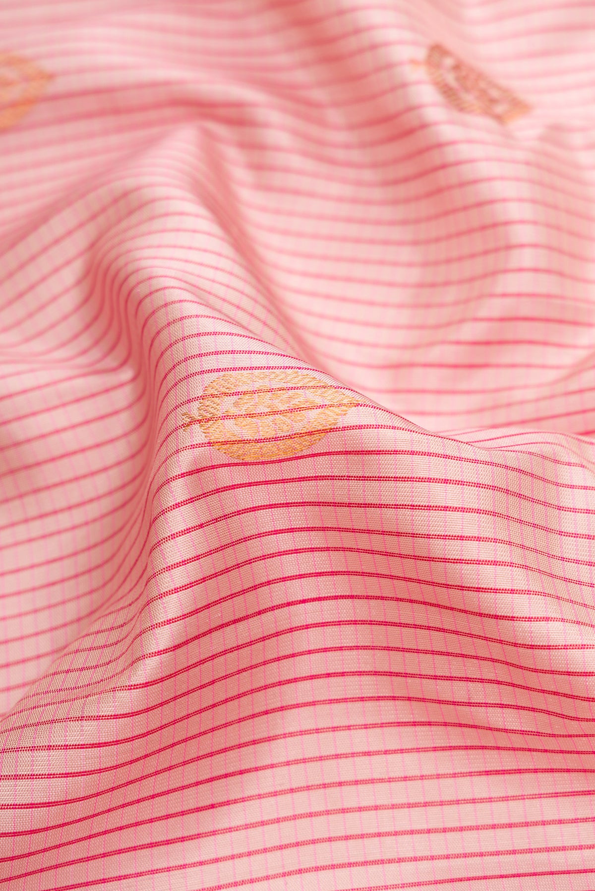 Close up of Rose pink Dual Tone Gadwal Silk Saree with Stripes on the body and Zari Border.  displaying folds
