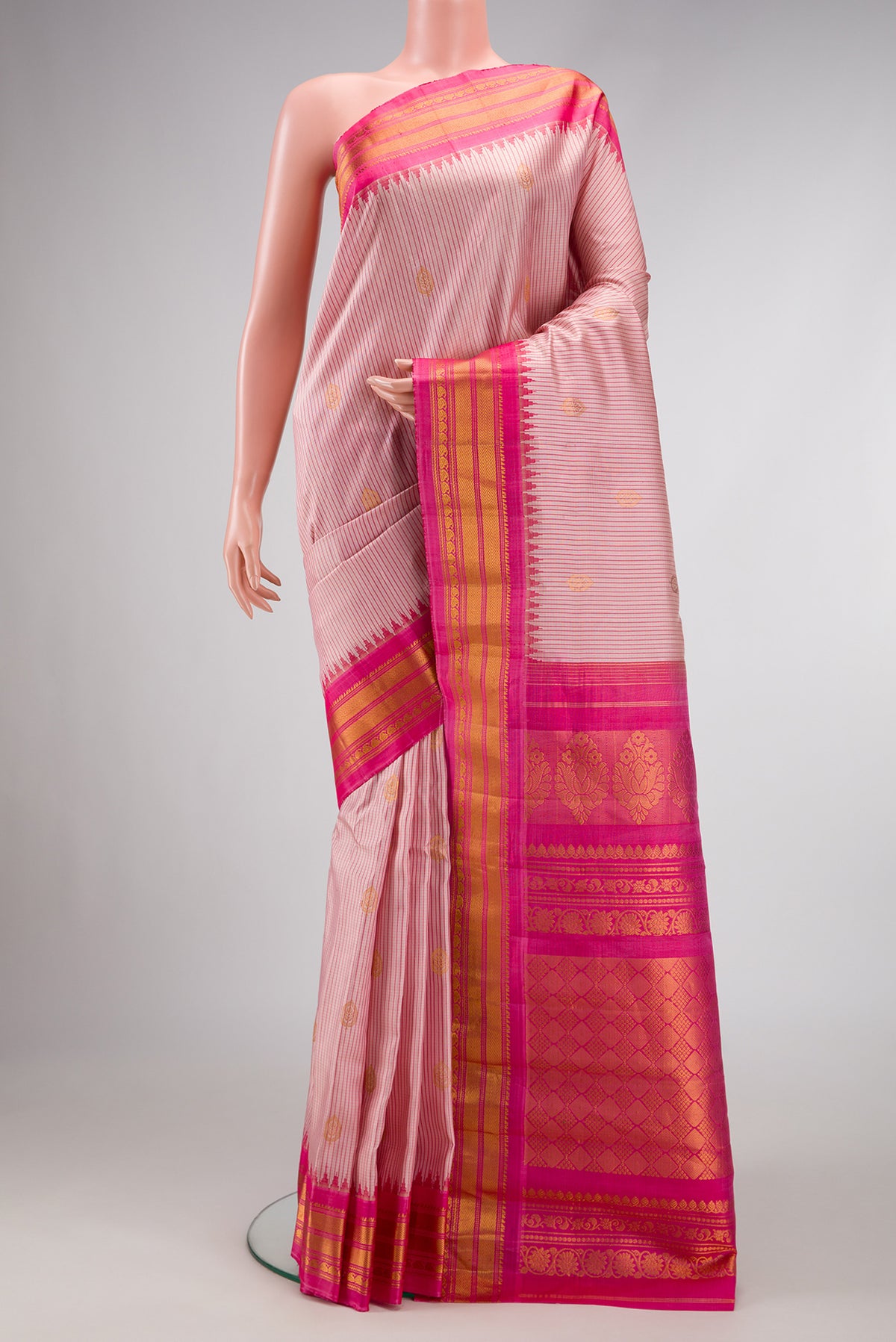 Rose pink Dual Tone Gadwal Silk Saree with Stripes on the body and Zari Border.  displayed on a mannequin