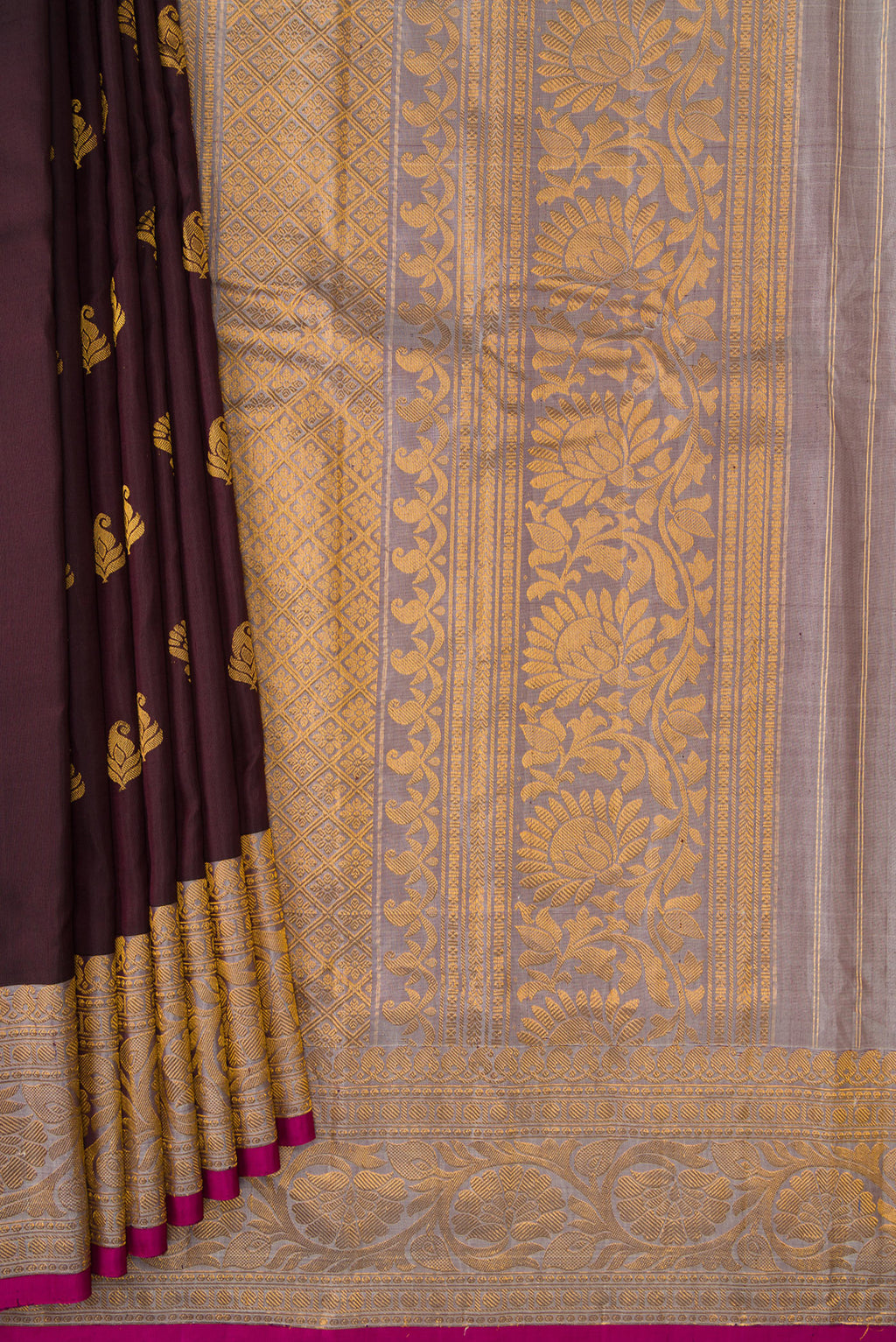 Pleats and pallu of Coffee Brown Dual Tone Gadwal Silk Saree with Zari Butta on the body and Zari Border. 
