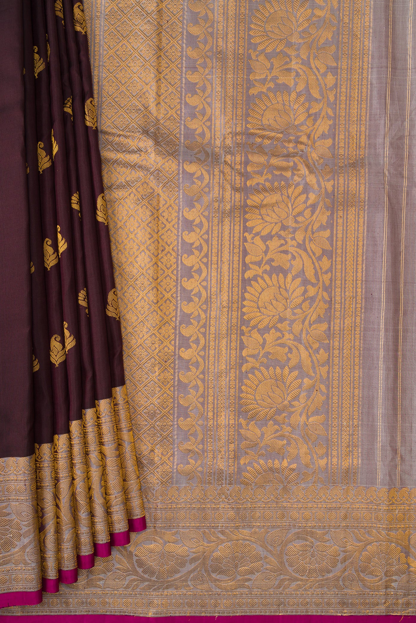 Pleats and pallu of Coffee Brown Dual Tone Gadwal Silk Saree with Zari Butta on the body and Zari Border. 