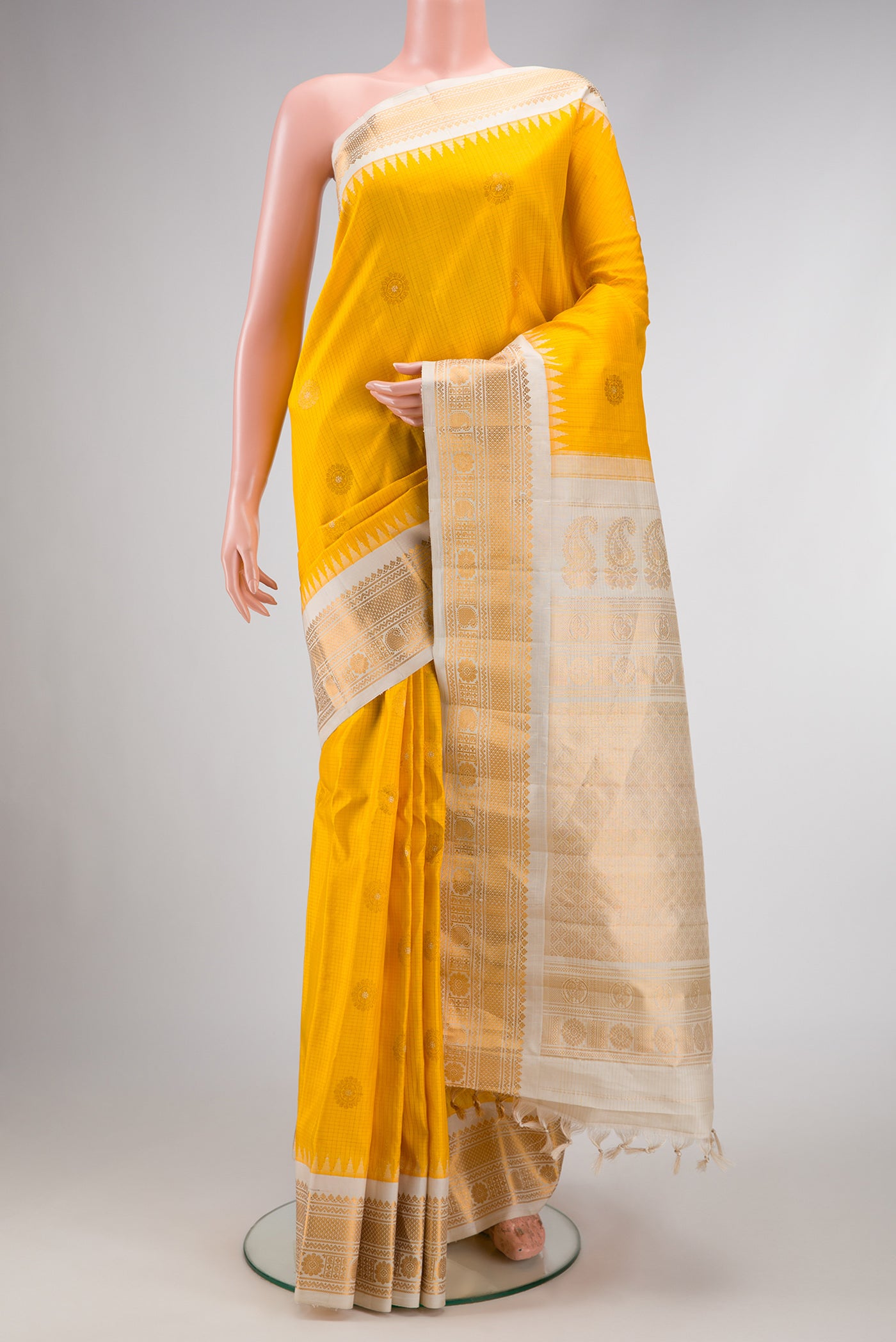 Yellow Dual Tone Gadwal Silk Saree with Zari Butta on the body and Zari Border.  displayed on a mannequin