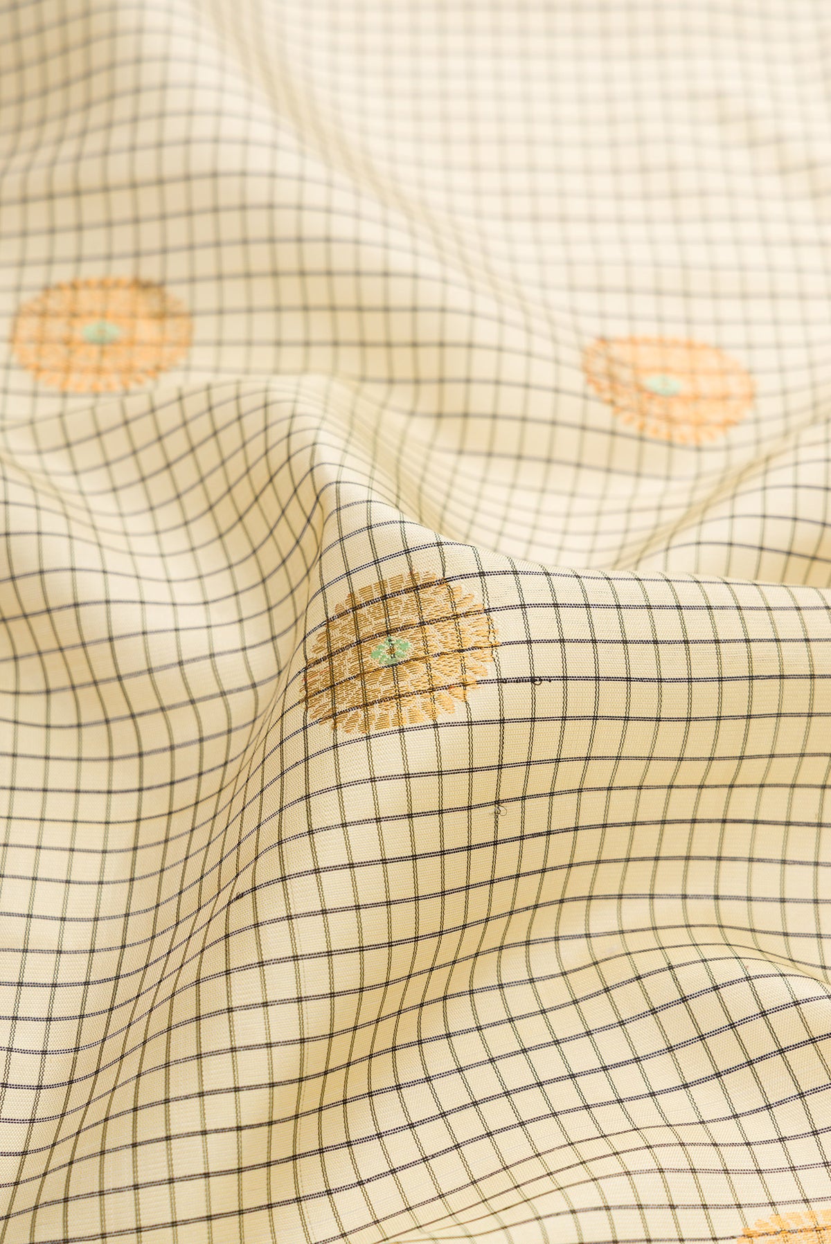 Close up of Sandal Dual Tone Gadwal Silk Saree with Checked design on the body and Zari Border.  displaying folds