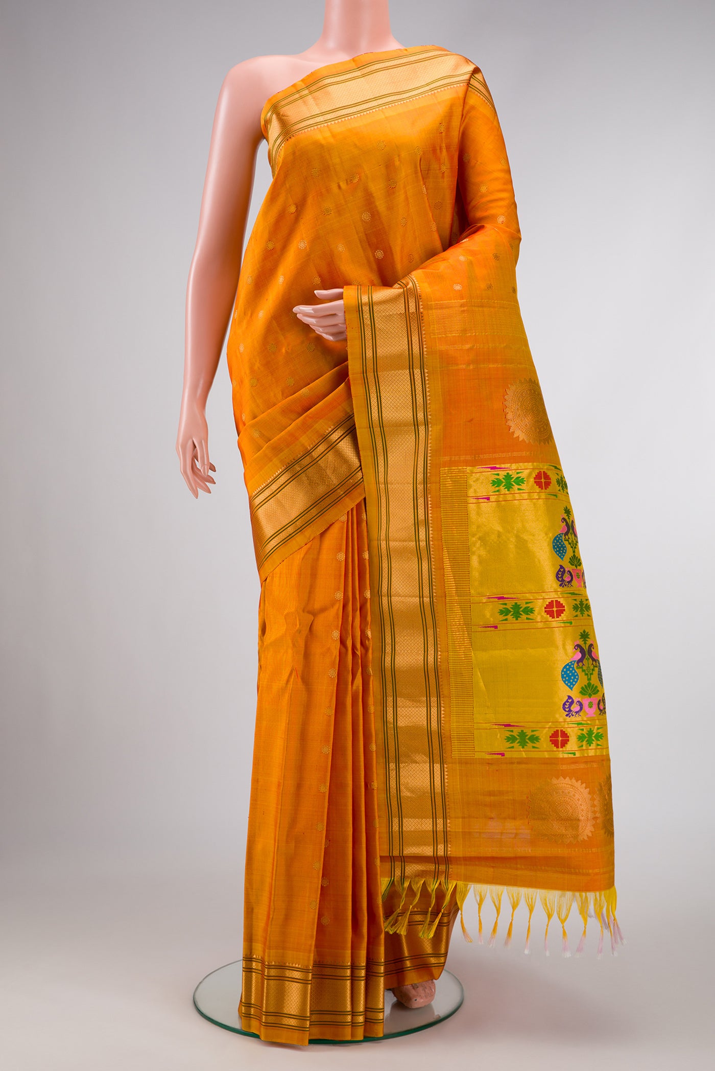 Mustard Dual Tone Gadwal Silk Saree with Zari Butta on the body and Paithani Border.  displayed on a mannequin