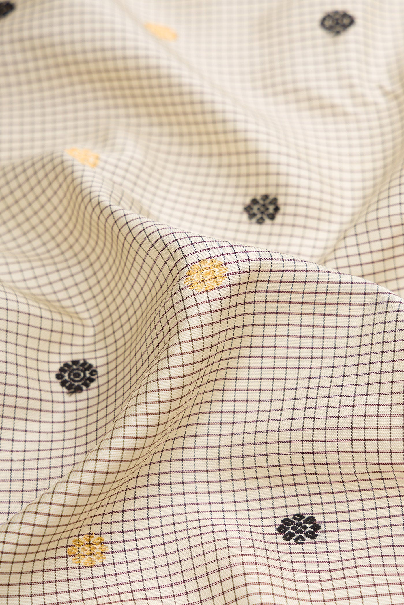 Close up of Grey Dual Tone Gadwal Silk Saree with Zari And Thread Butta on the body and Zari Border.  displaying folds