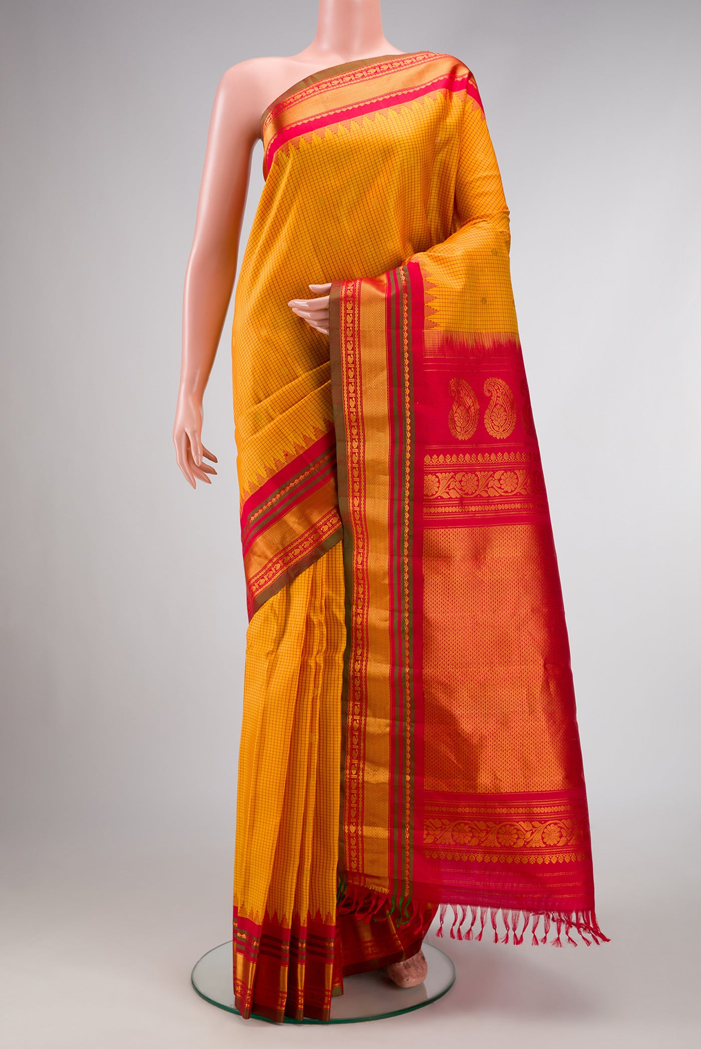 Mustard Dual Tone Gadwal Silk Saree with Checked design on the body and Zari Border.  displayed on a mannequin