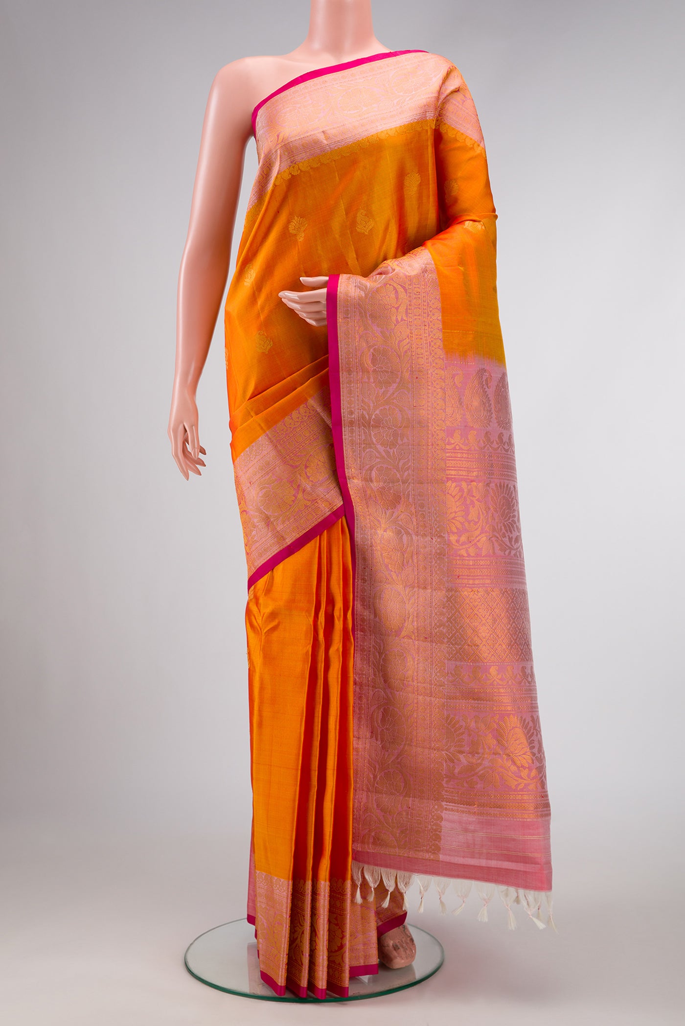 Mustard Dual Tone Gadwal Silk Saree with Zari Butta on the body and Zari Border.  displayed on a mannequin