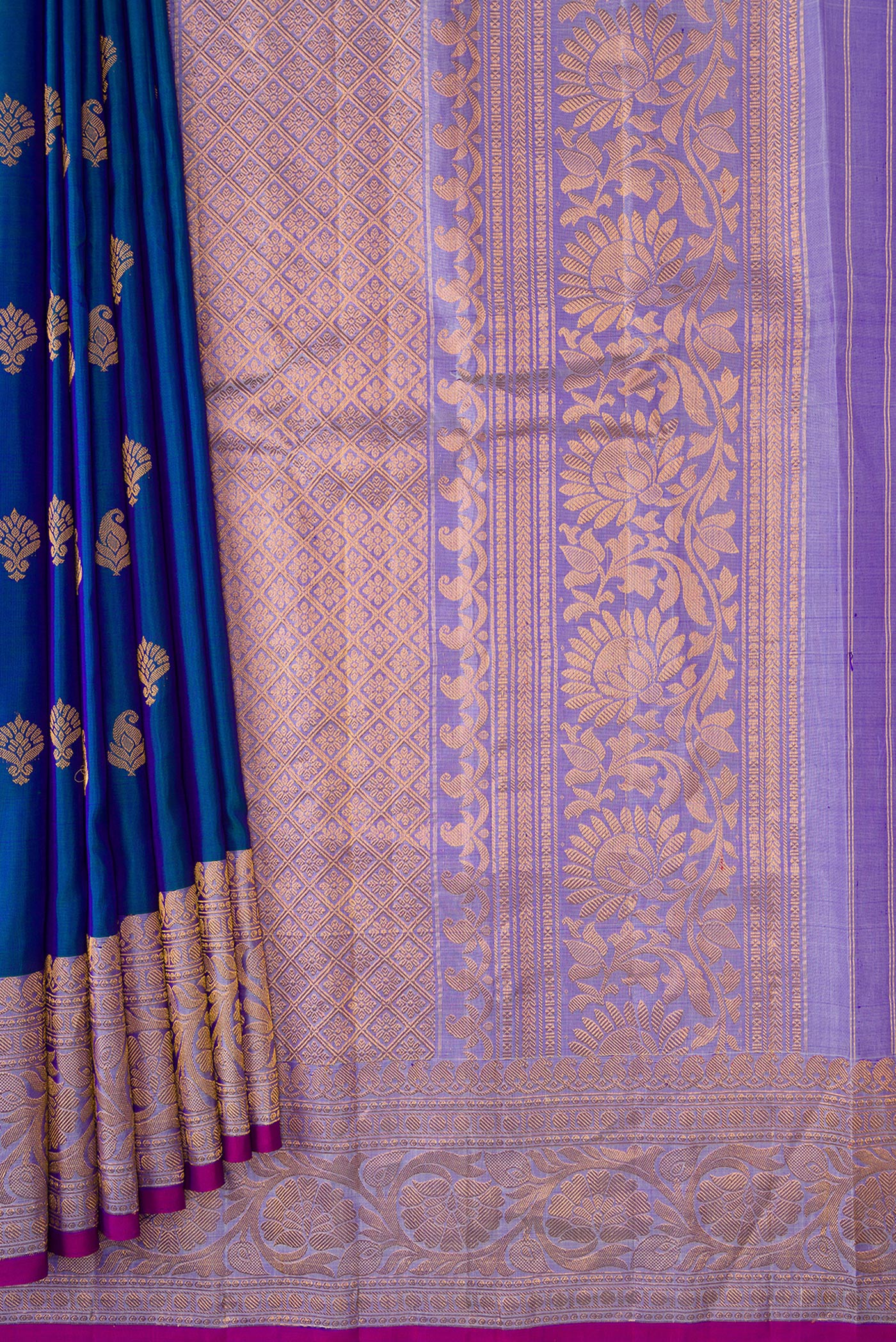 Pleats and pallu of Peacock Blue Dual Tone Gadwal Silk Saree with Zari Butta on the body and Zari And Thread Border. 