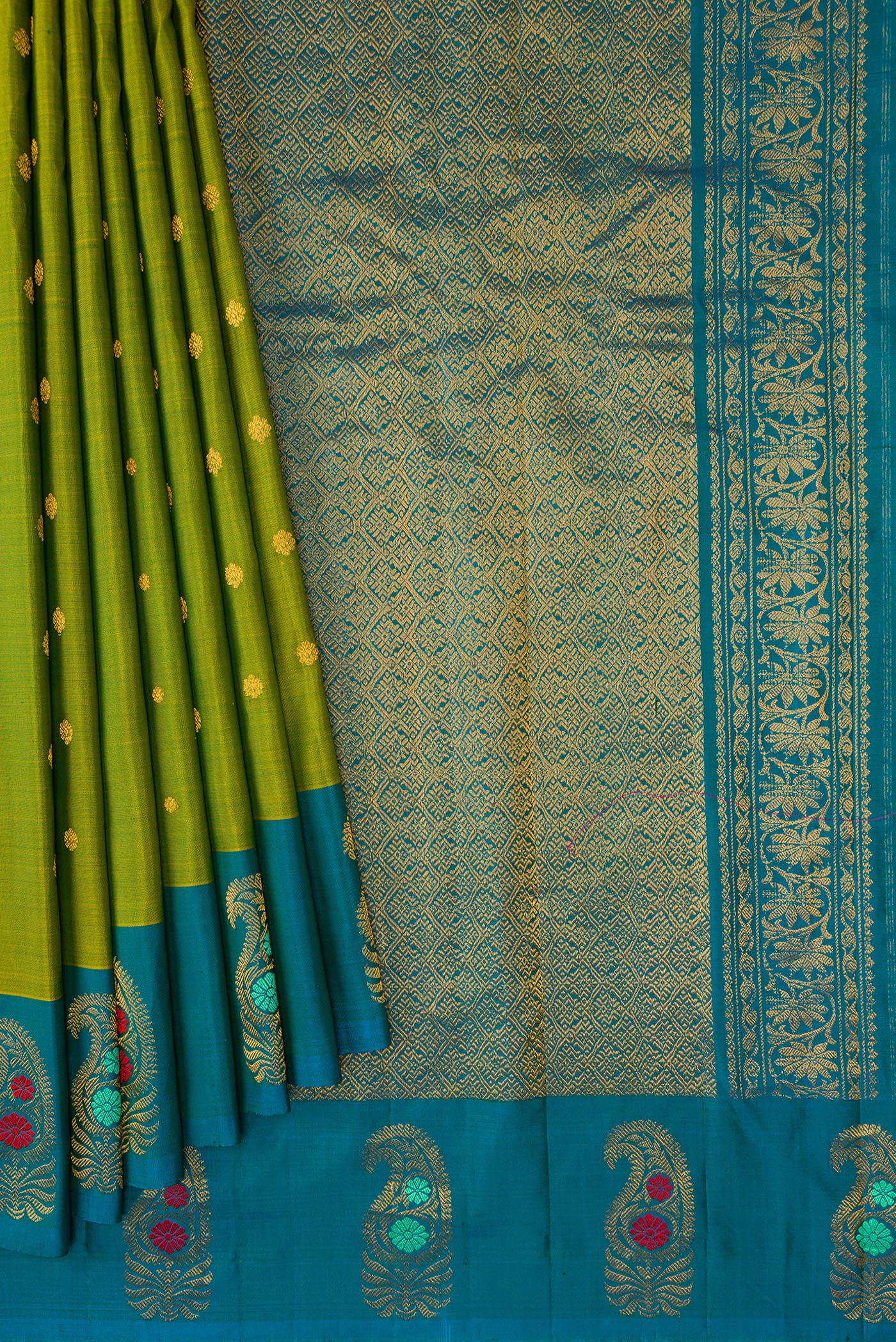 Pleats and pallu of Green Dual Tone Gadwal Silk Saree with Zari Butta on the body and Fancy Border. 