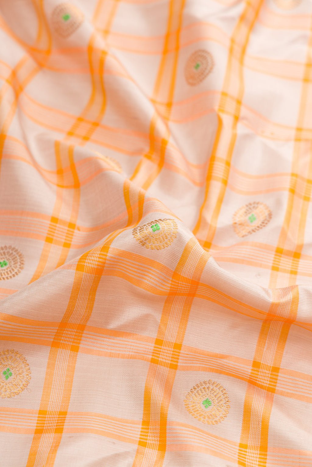 Close up of Grey Dual Tone Gadwal Silk Saree with Checked design on the body and Zari Border.  displaying folds