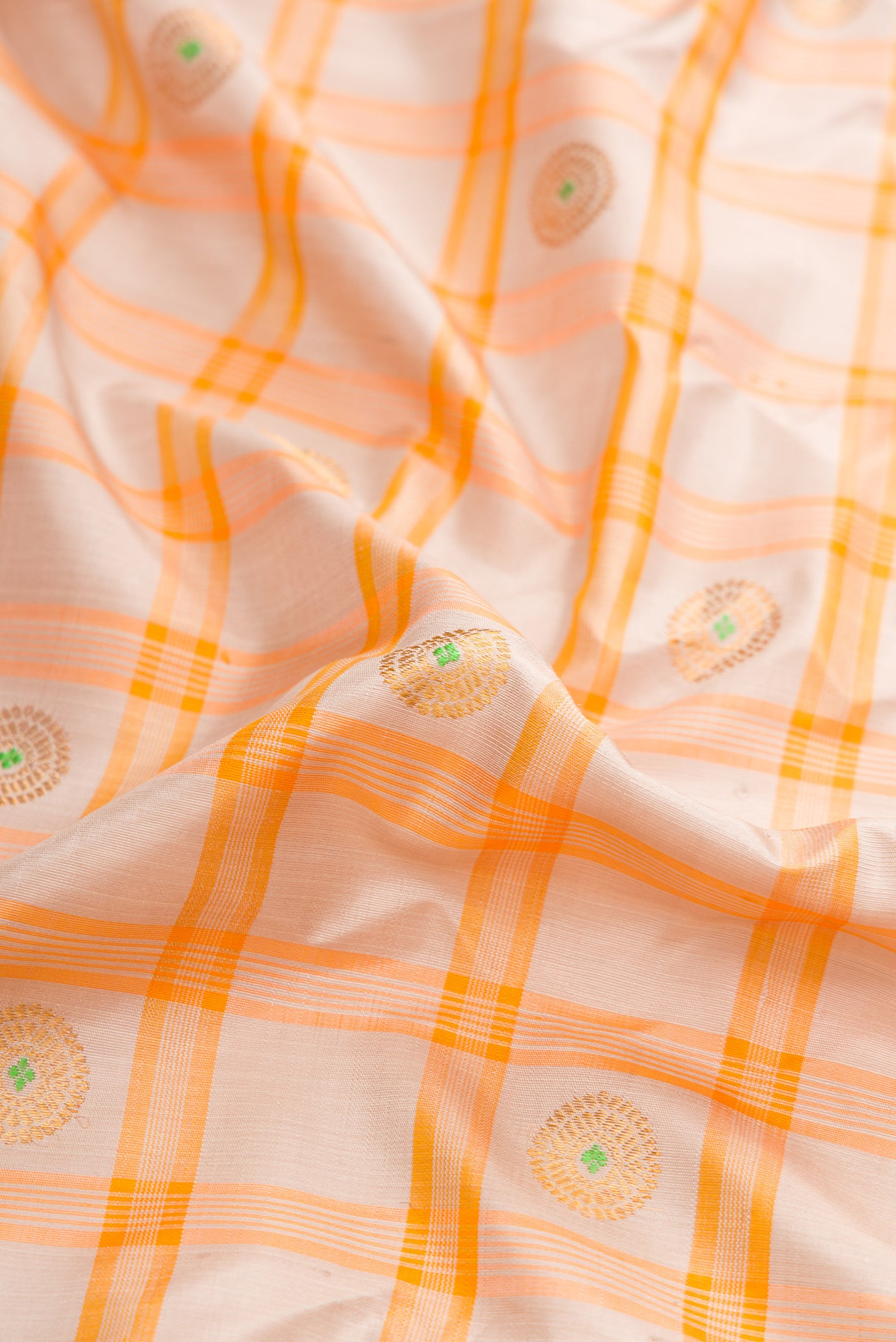 Close up of Grey Dual Tone Gadwal Silk Saree with Checked design on the body and Zari Border.  displaying folds