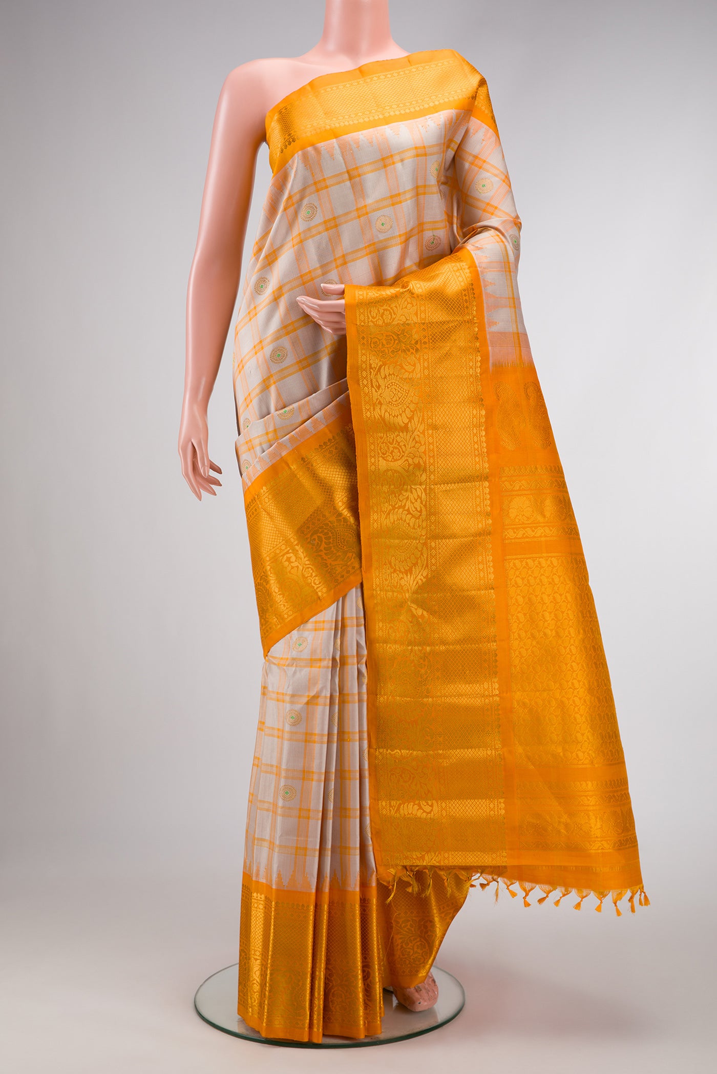 Grey Dual Tone Gadwal Silk Saree with Checked design on the body and Zari Border.  displayed on a mannequin