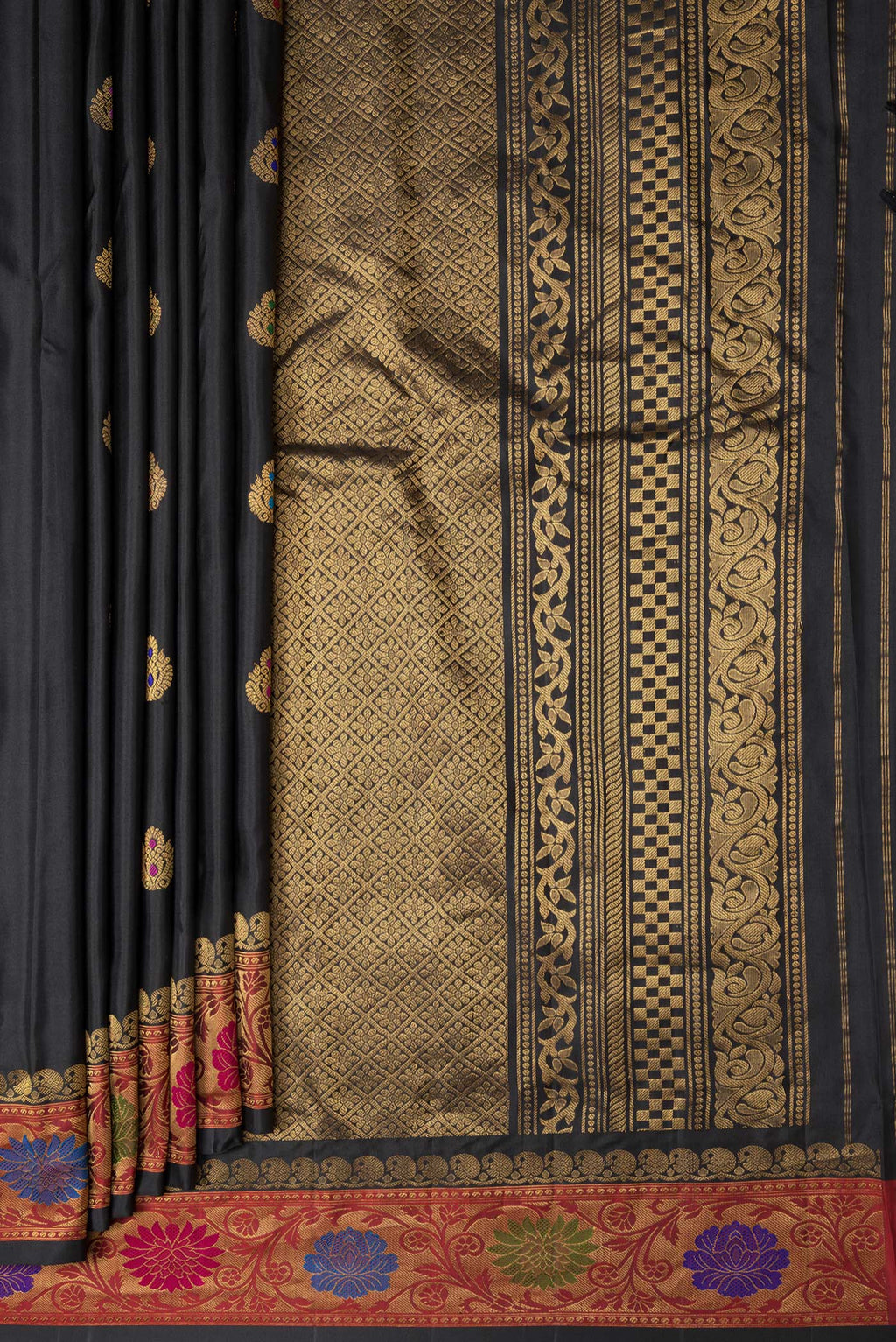 Pleats and pallu of Black Dual Tone Gadwal Silk Saree with Zari And Thread Butta on the body and Zari Border. 