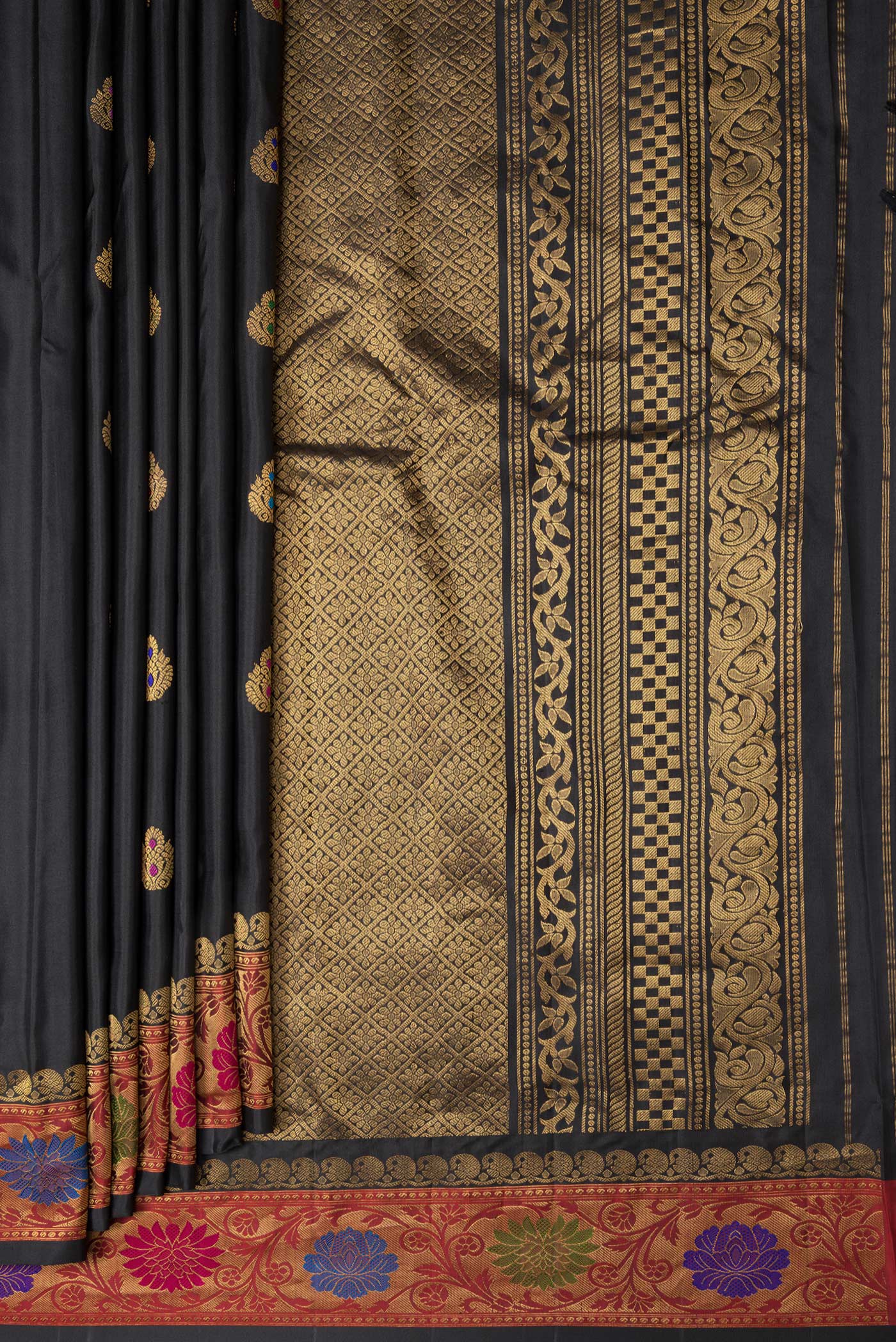 Pleats and pallu of Black Dual Tone Gadwal Silk Saree with Zari And Thread Butta on the body and Zari Border. 