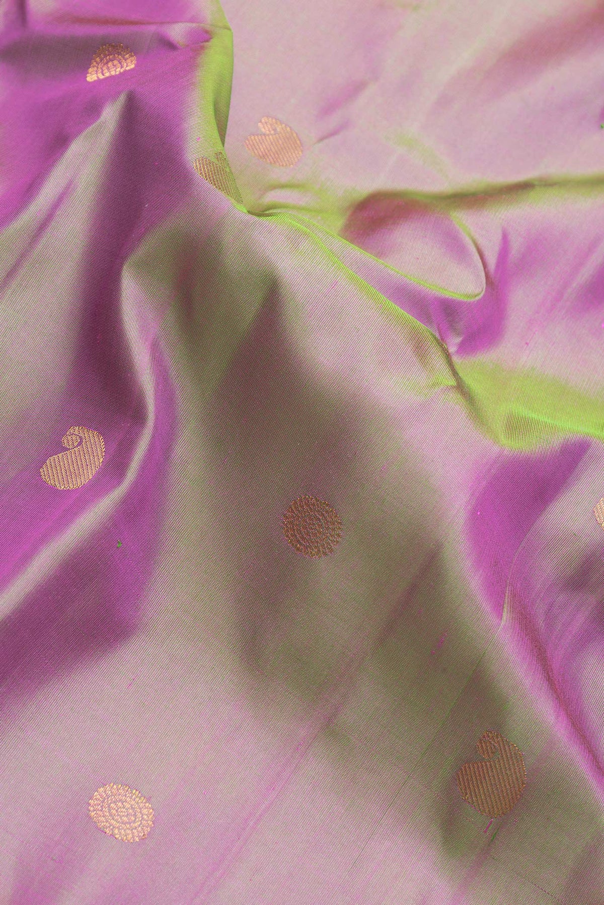 Close up of Green Dual Tone Gadwal Silk Saree with Zari Butta on the body and Zari Border.  displaying folds