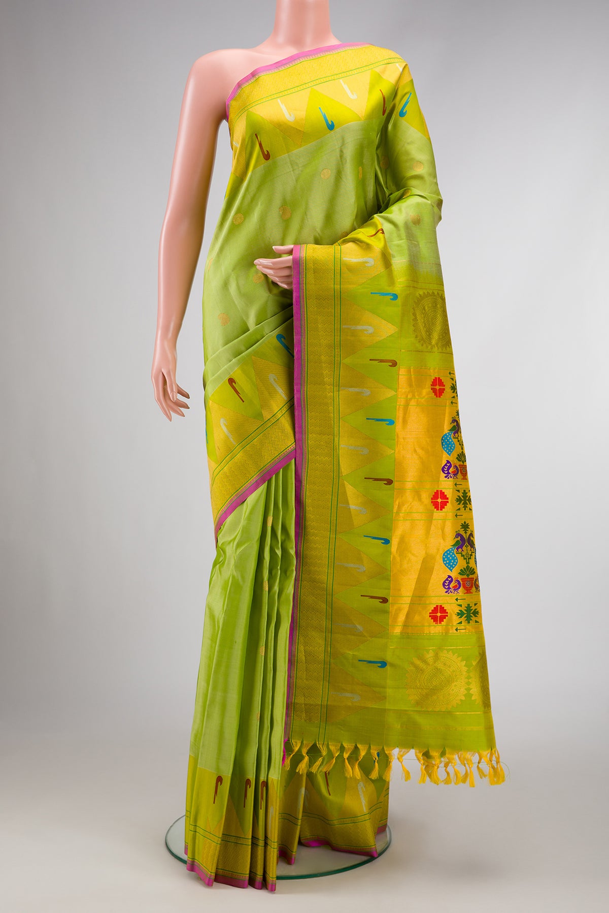 Light Green Dual Tone Gadwal Silk Saree with Zari Butta on the body and Temple Border.  displayed on a mannequin