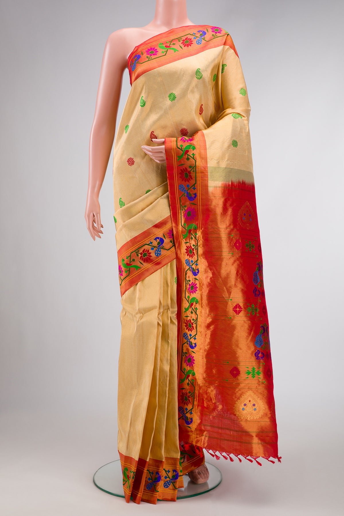 Gold Dual Tone Gadwal Silk Saree with Zari And Thread Butta on the body and Zari And Thread Border.  displayed on a mannequin
