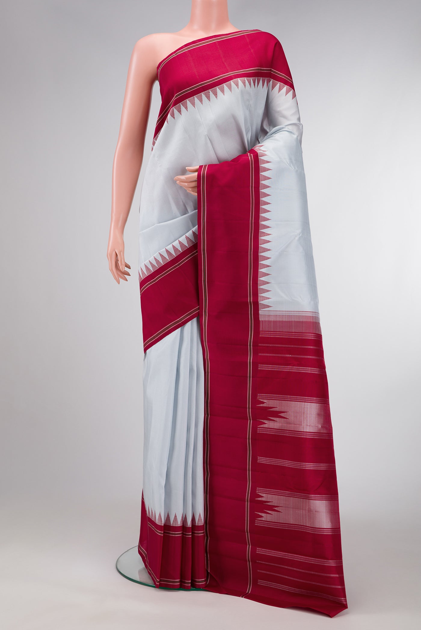 Light Blue Dual Tone Kanjivaram Silk Saree with Plain Body and Thread Border.  displayed on a mannequin