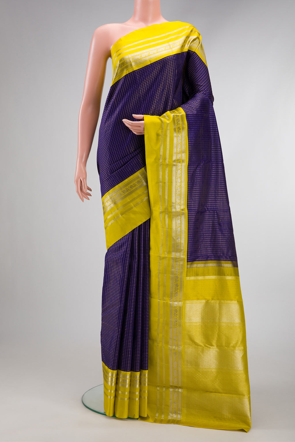 Violet Dual Tone Kanjivaram Silk Saree with Stripes on the body and Zari Border.  displayed on a mannequin
