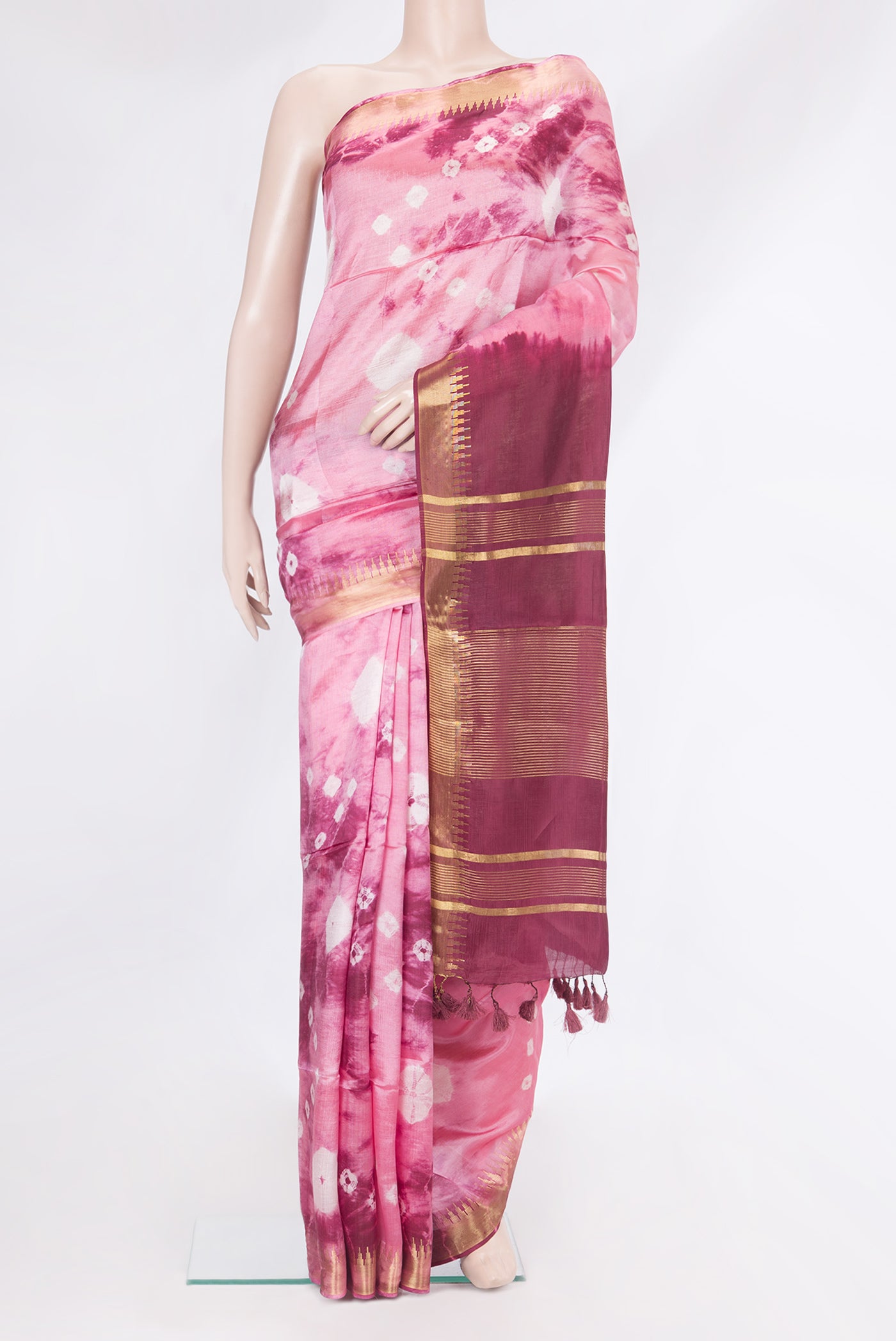 Pink Blended Tussar Silk Saree with Printed design on the body and Zari Border.  displayed on a mannequin