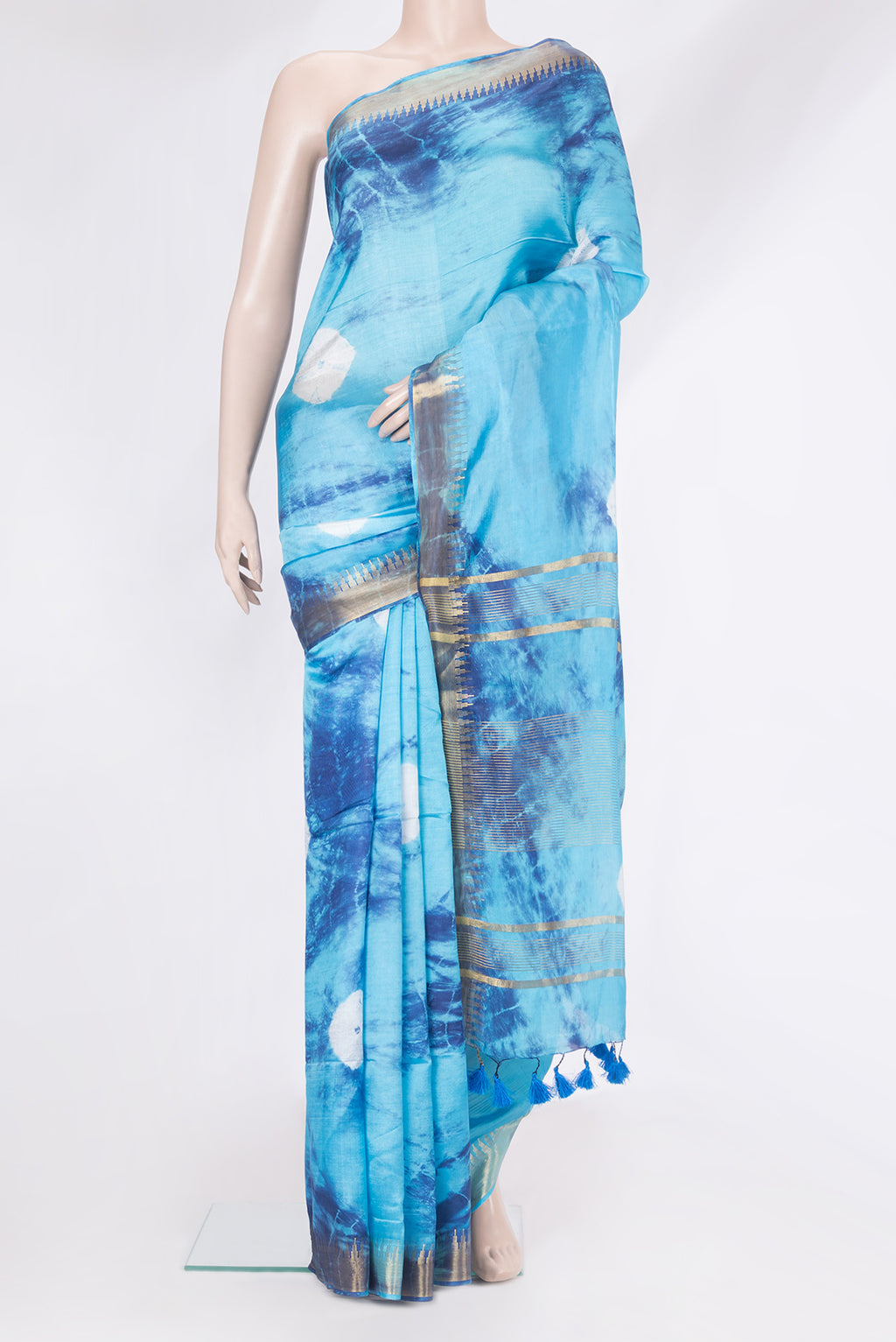 Sky Blue Blended Tussar Silk Saree with Bandhani Print on the body and Zari Border.  displayed on a mannequin