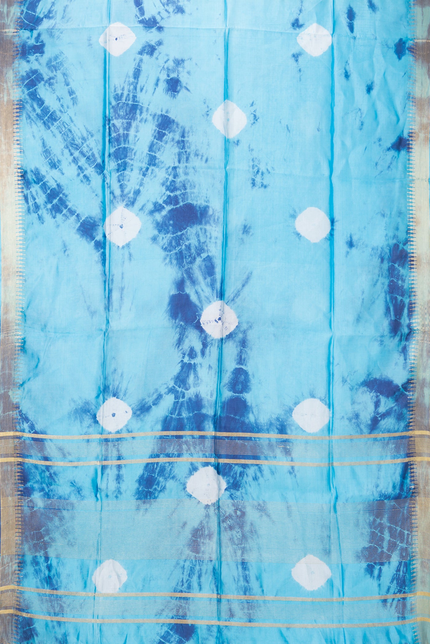 Flat view of Sky Blue Blended Tussar Silk Saree with Bandhani Print on the body and Zari Border. 