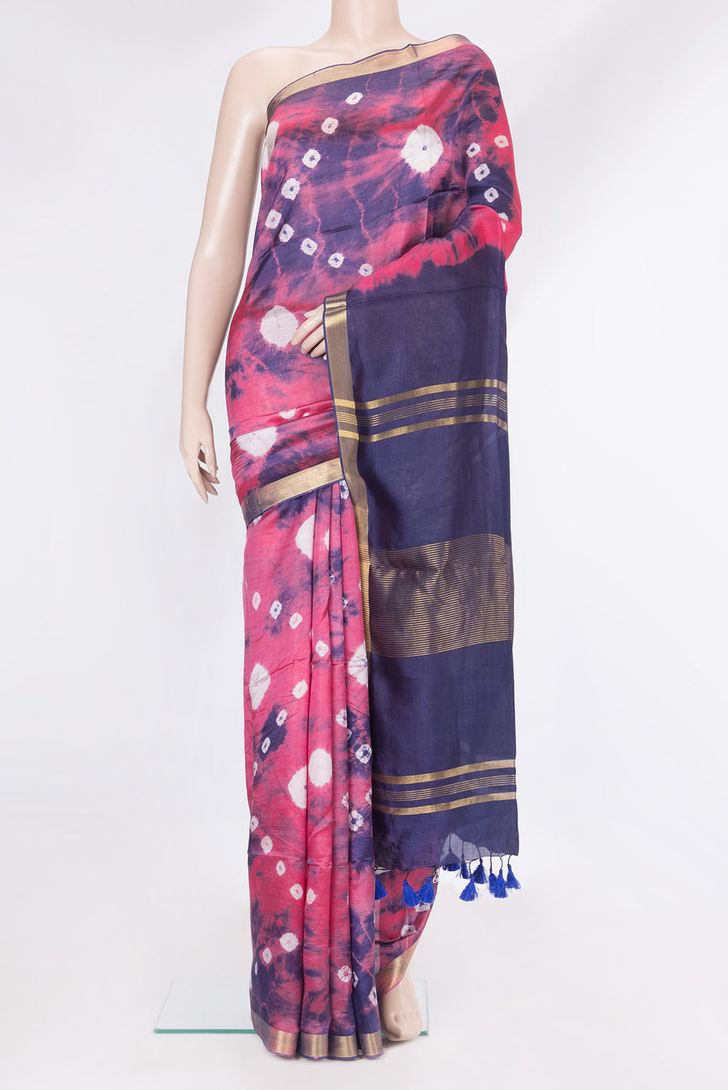 Coral Blended Tussar Silk Saree with Bandhani Print on the body and Zari Border.  displayed on a mannequin