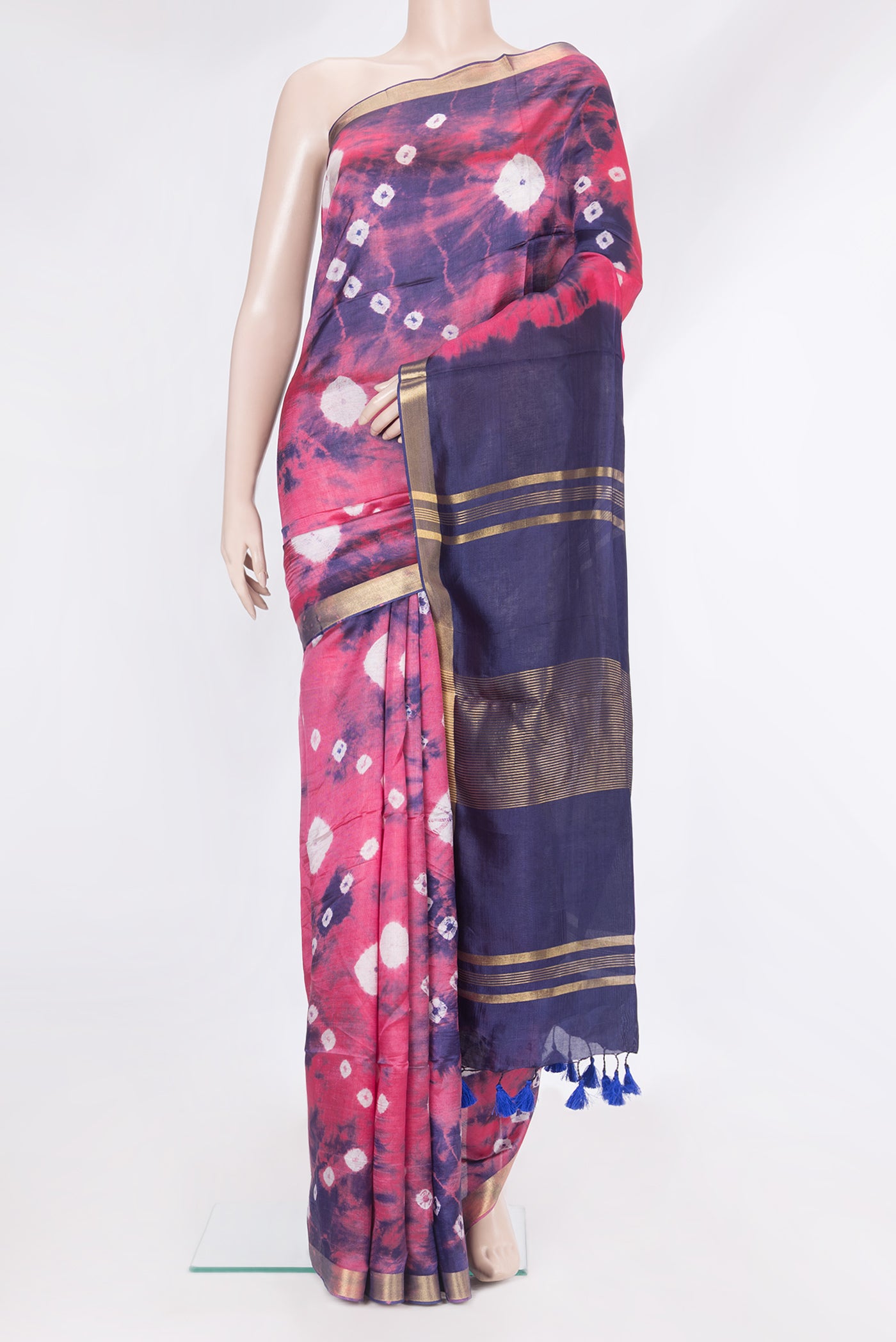 Coral Blended Tussar Silk Saree with Bandhani Print on the body and Zari Border.  displayed on a mannequin