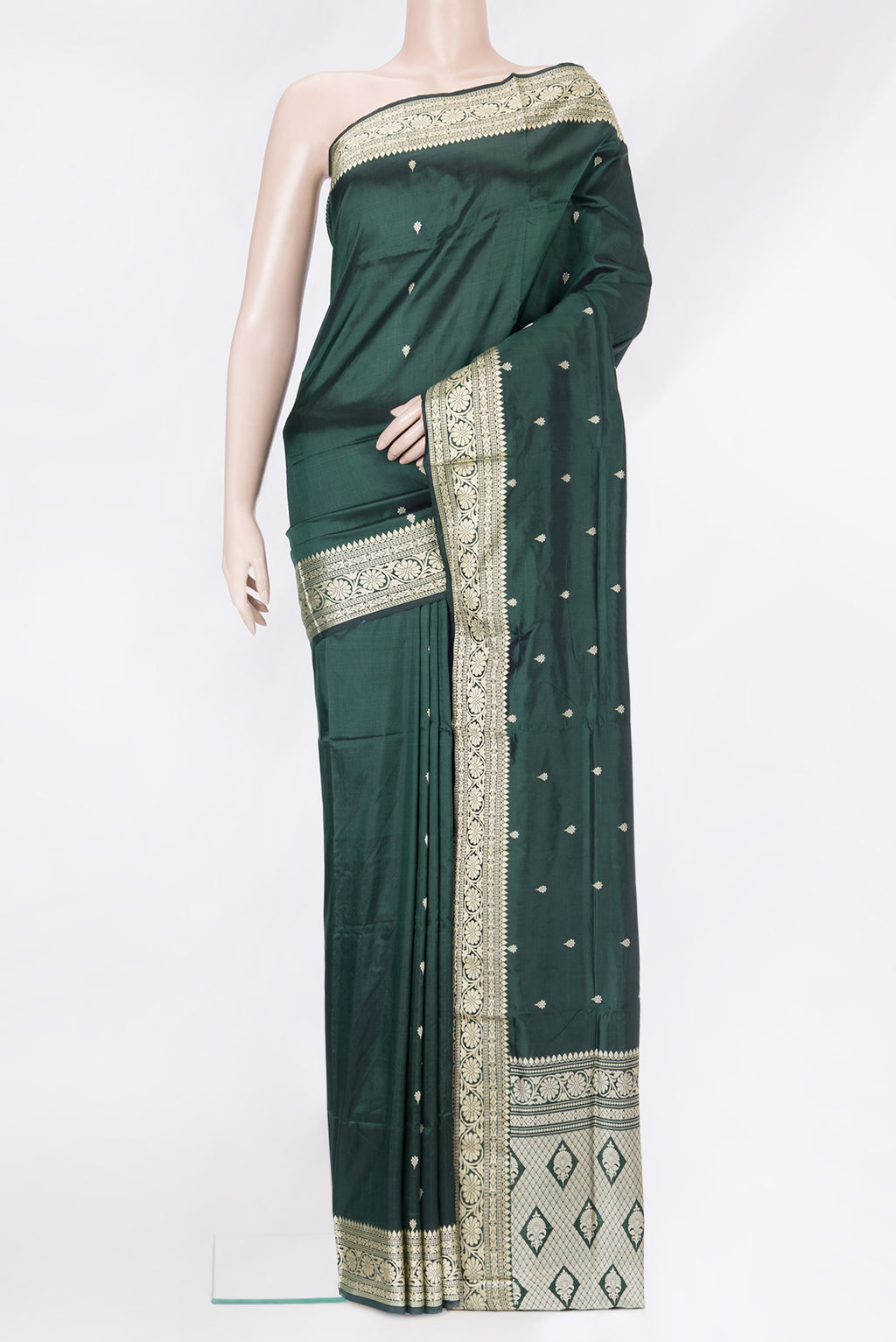 Bottle Green Banarasi Silk Saree with Thread Butta on the body and Thread Border.  displayed on a mannequin