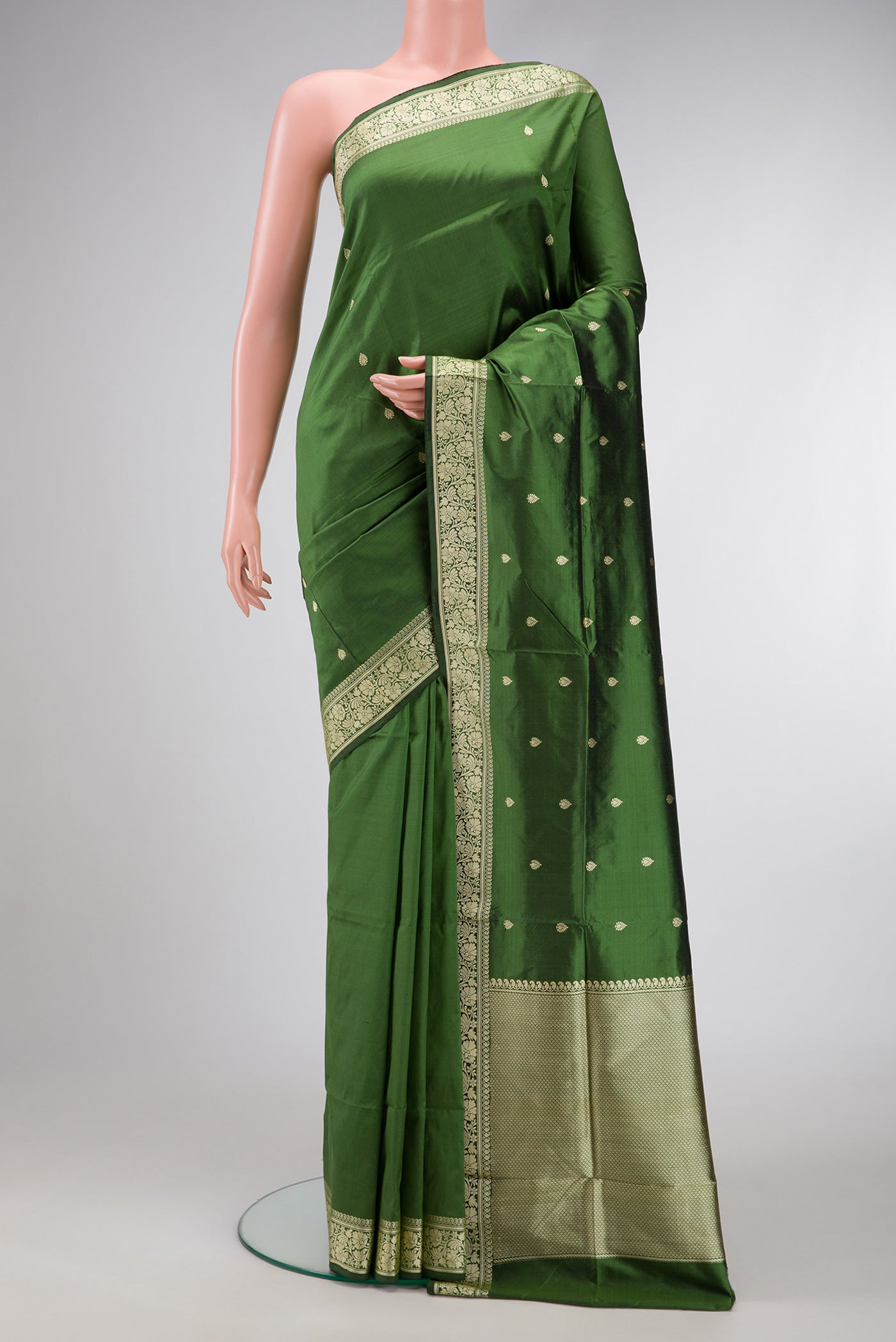 Green Dual Tone Banarasi Silk Saree with Thread Butta on the body and Thread Border.  displayed on a mannequin